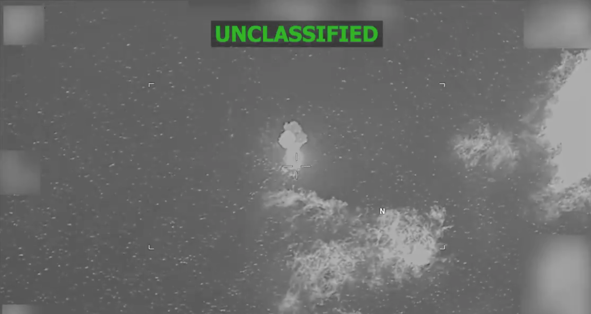 Video posted on social media by U.S. Southern Command shows a black, boat-shaped image before what appears to be an explosion, followed by a column of fire rising from the ocean