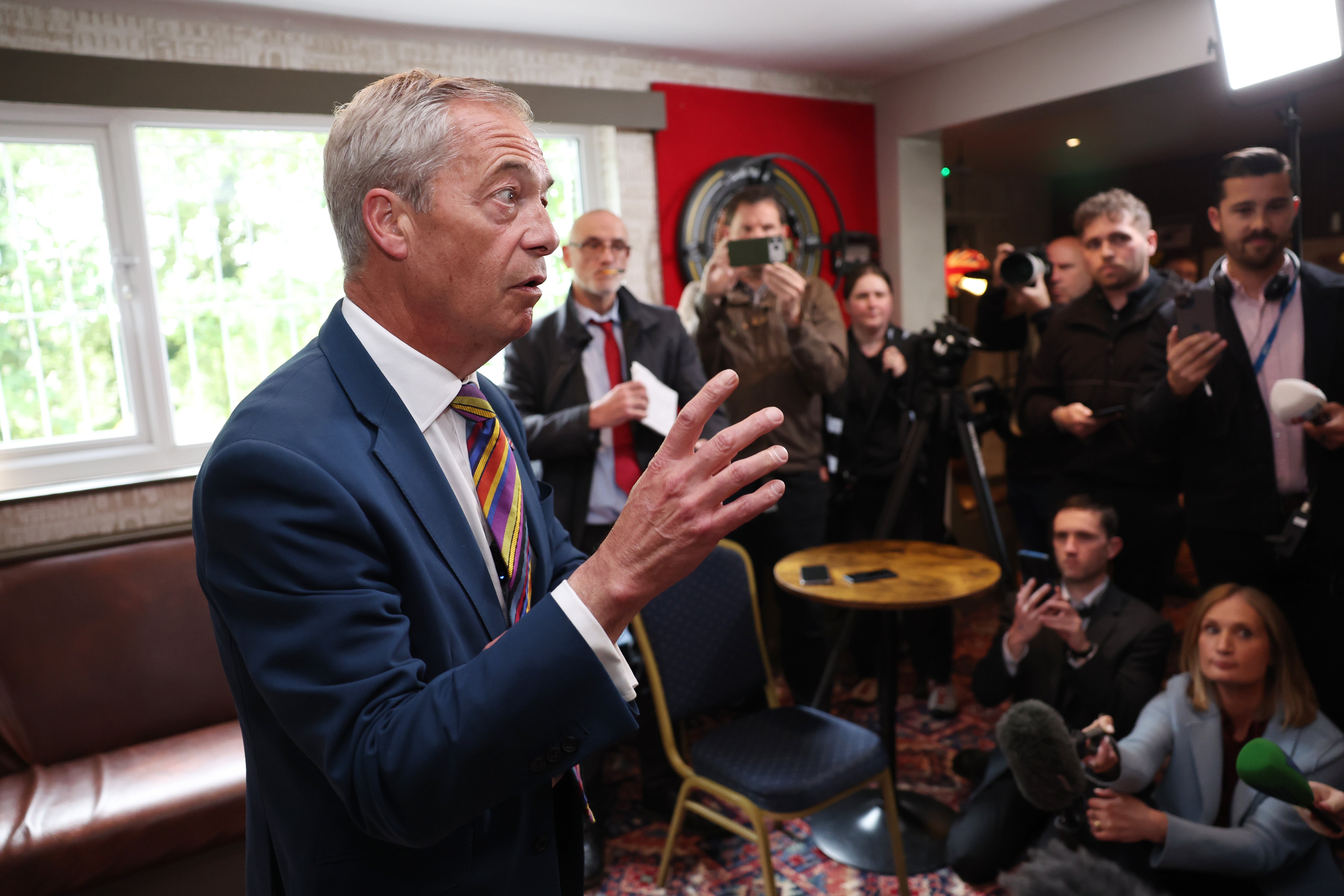 Reform England leader Nigel Farage speaks to media at The Dam Bar And Grill in St Helens