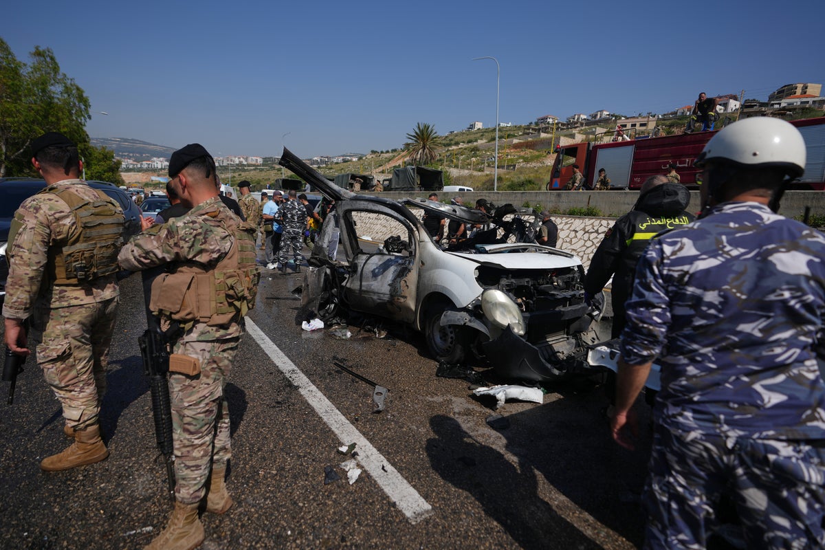 Israeli drone strikes near Beirut kill 4 and southern airstrikes kill at least 13