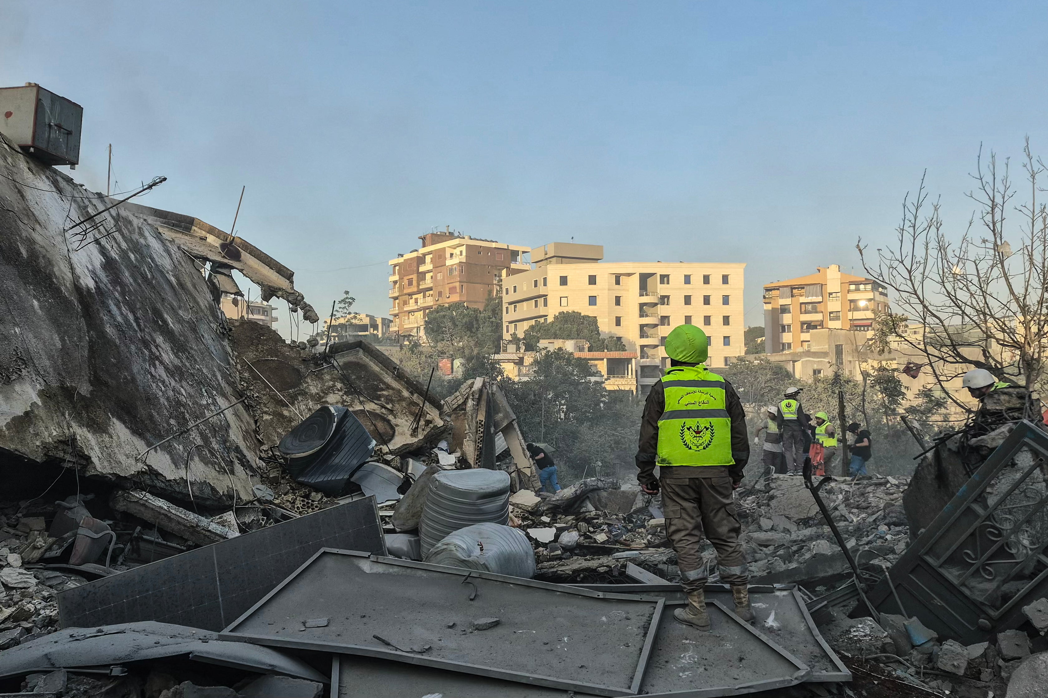 First responders search the rubble for victims at the site of an Israeli airstrike in the southern town of Nabatieh