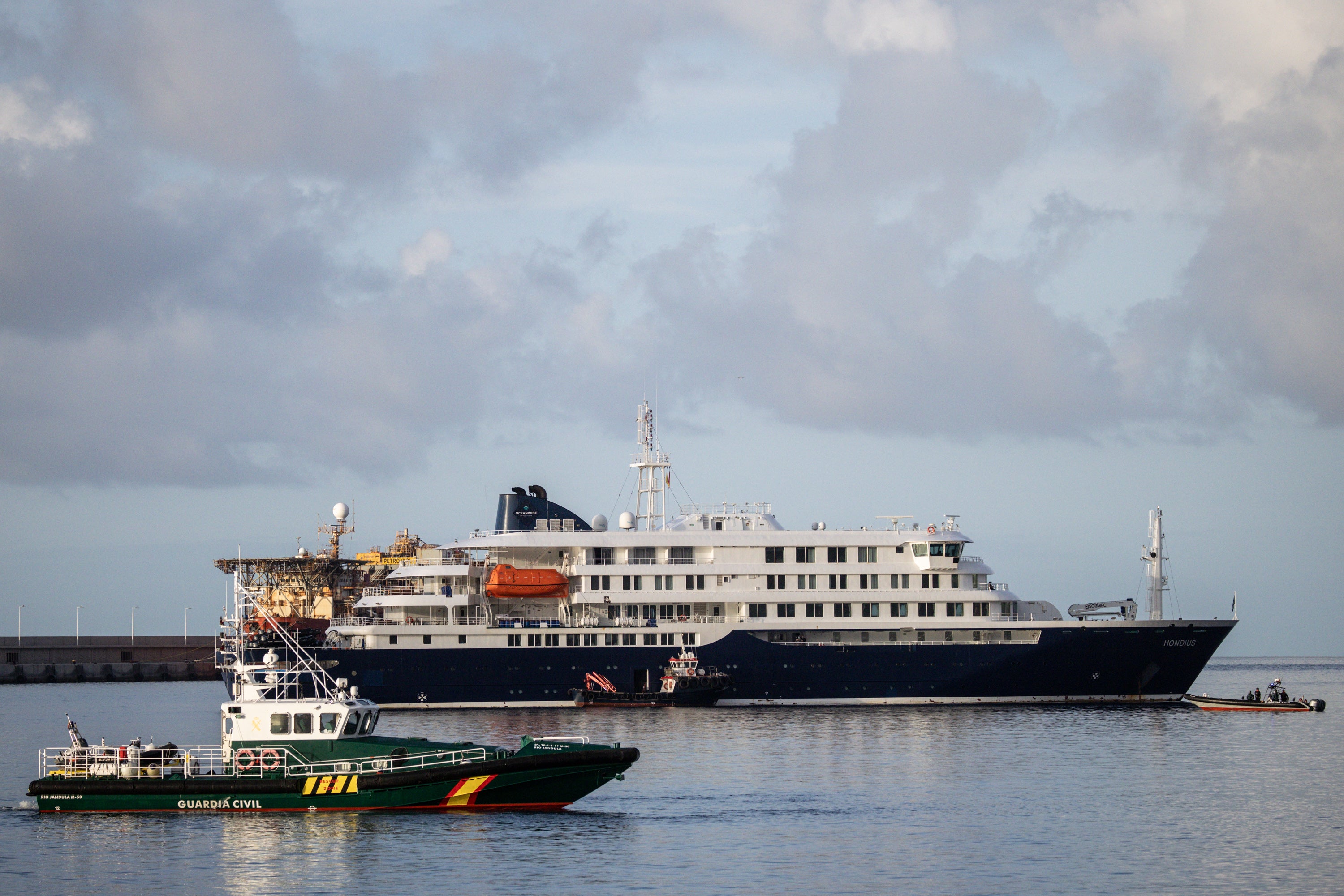 Guardia Civil boats surround the MV Hondius after docking in the Granadilla Port