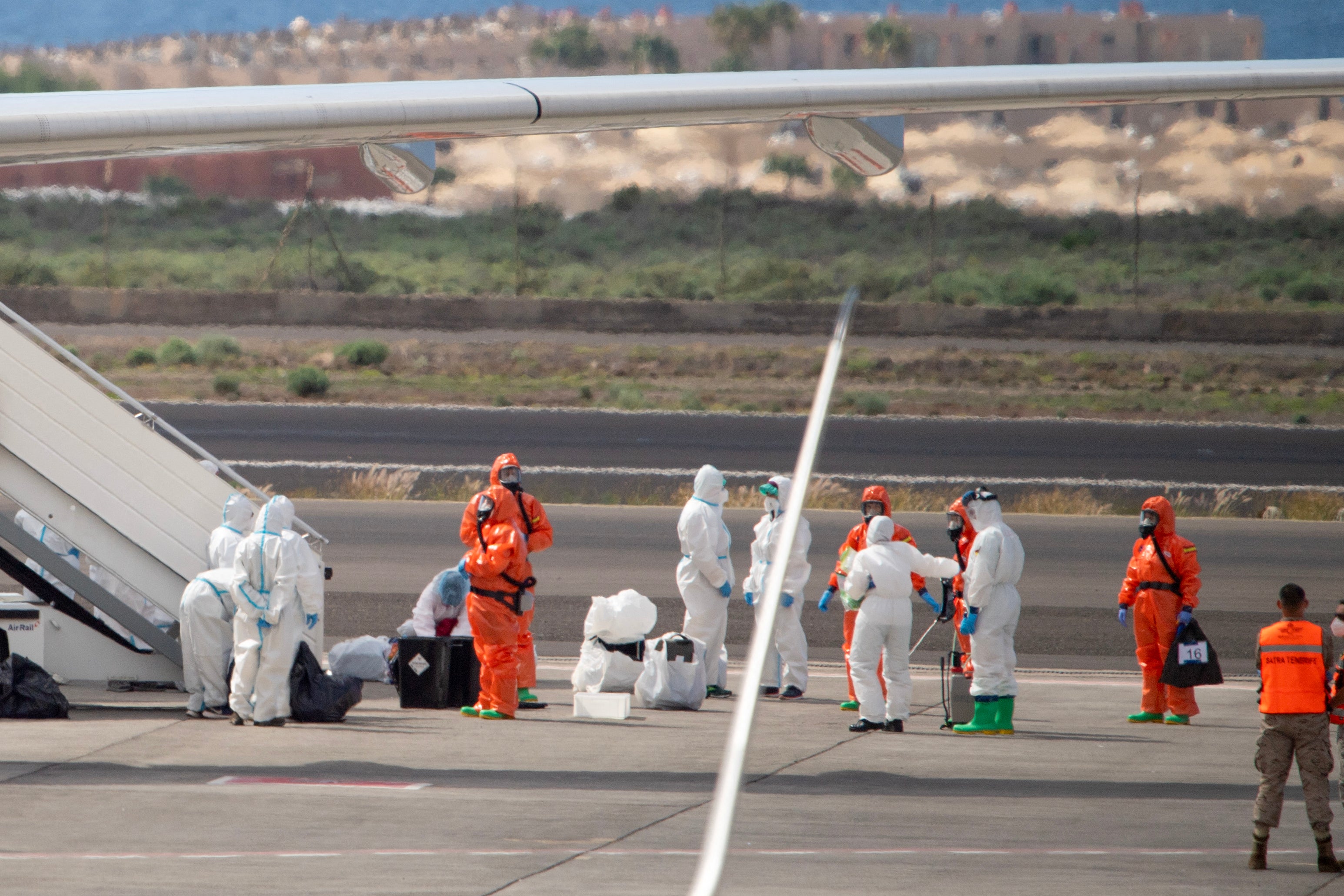 Spanish evacuees board a flight out of Tenerife