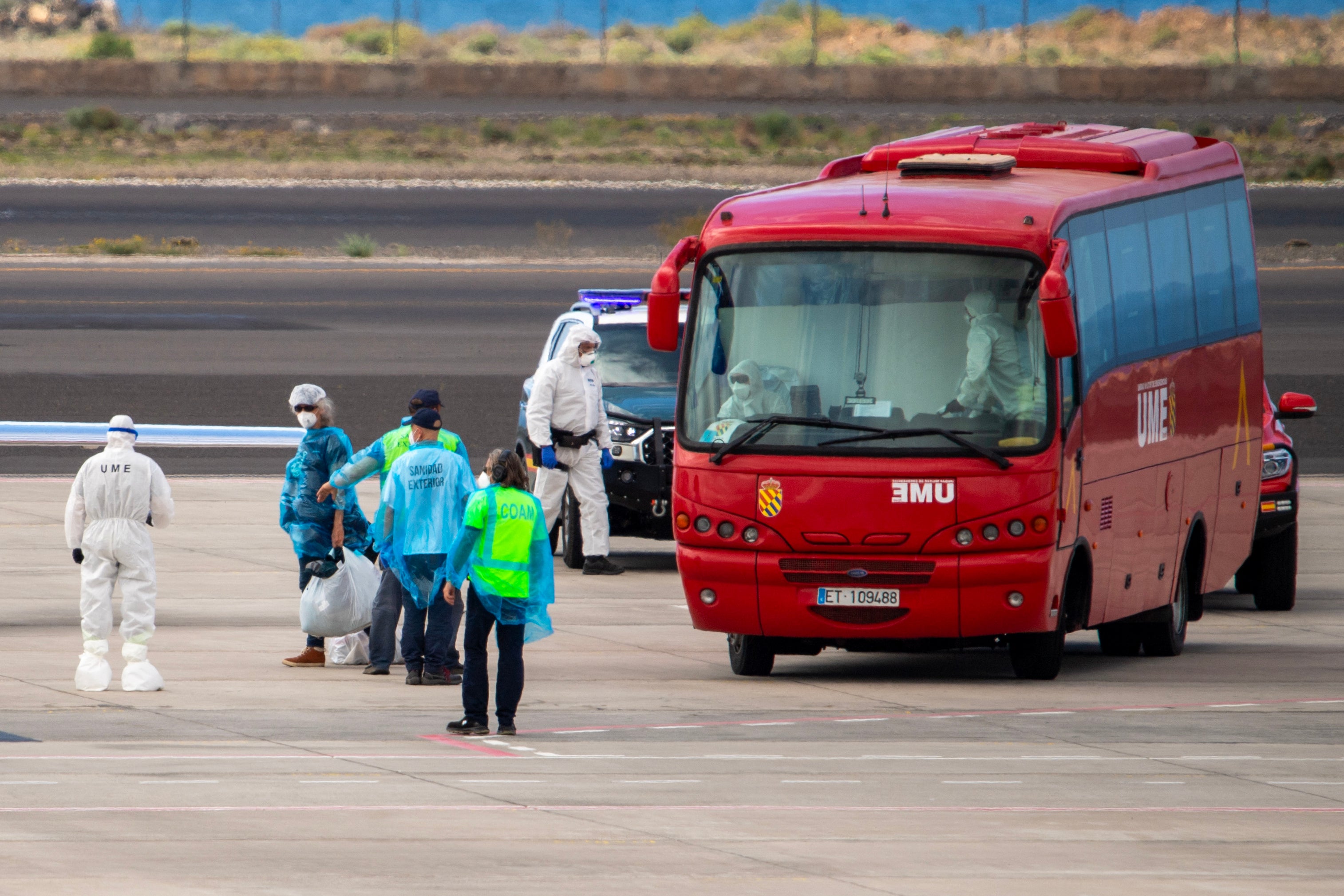 Passengers were taken to the airport in a military bus before boarding a French government plane