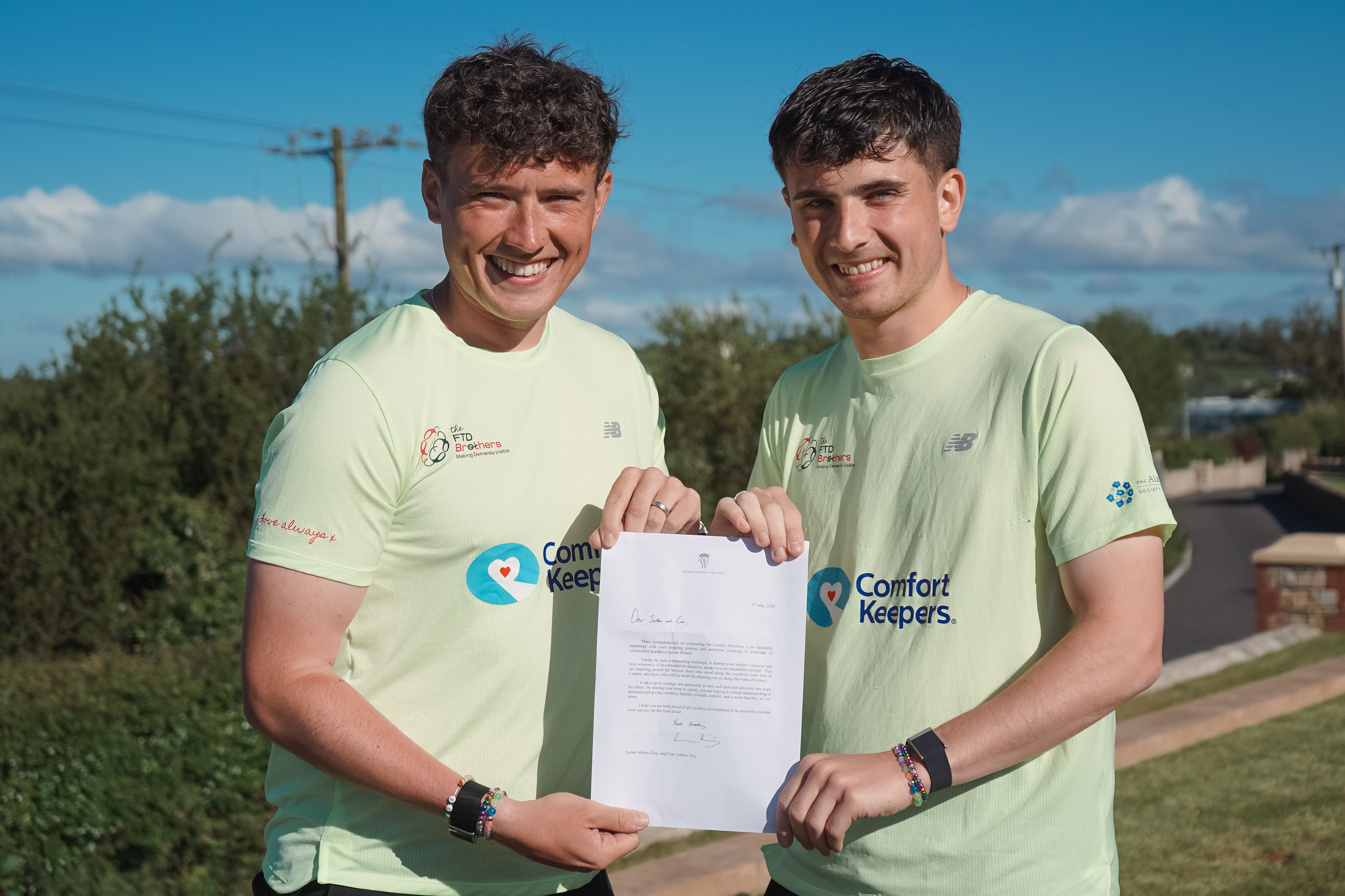 Jordan Adams (left) and Cian Adams (right) holding their letter from the Prince of Wales (Laura-Mary Carter/PA)