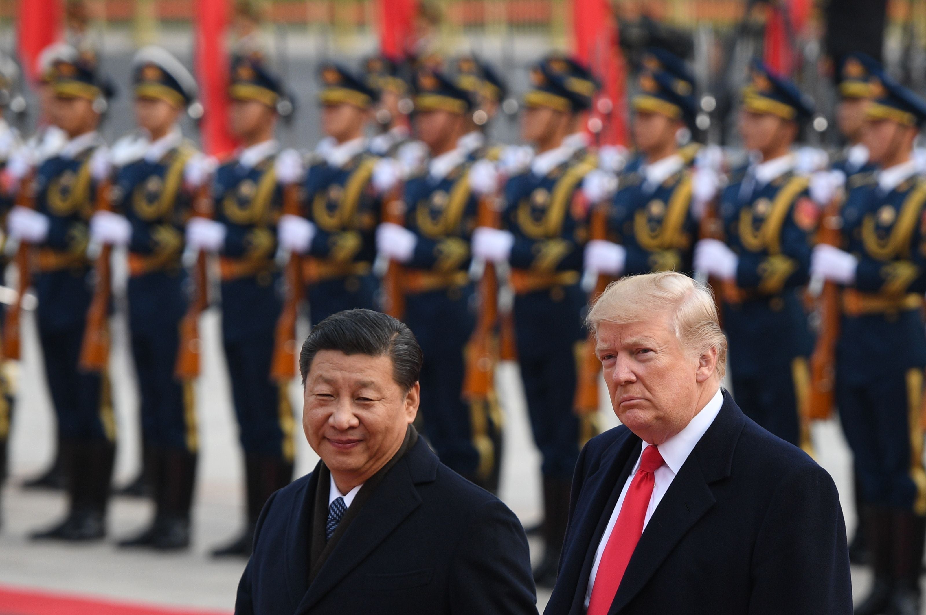President Xi Jinping and Donald Trump review Chinese honour guards during a welcome ceremony at the Great Hall of the People in Beijing in November 2017
