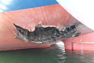 A South Korean cargo ship reported being damaged by an unknown object while traveling through the Strait of Hormuz last week