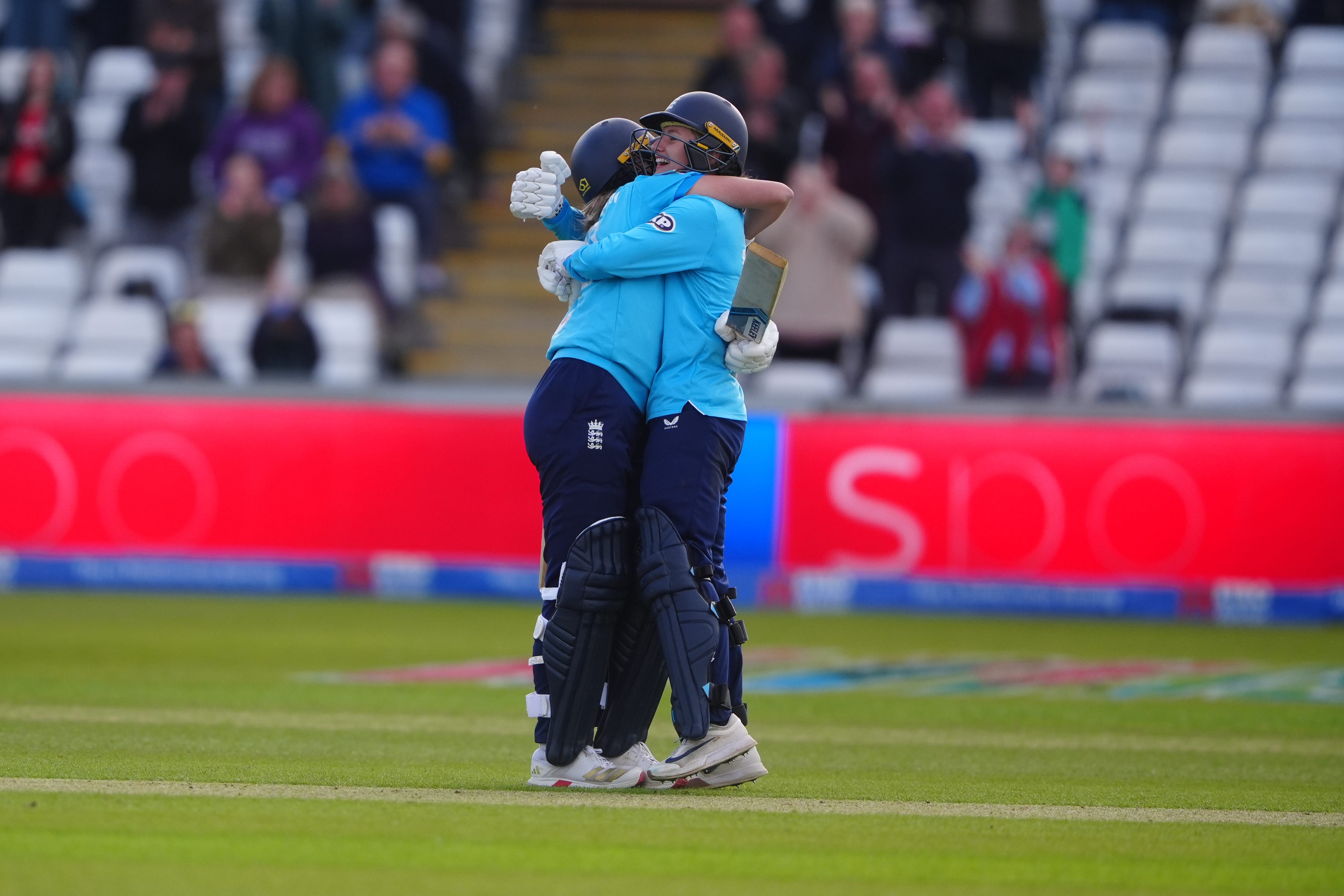 Charlie Dean (right) and Tilly Corteen-Coleman celebrate England’s victory (Owen Humphreys/PA)