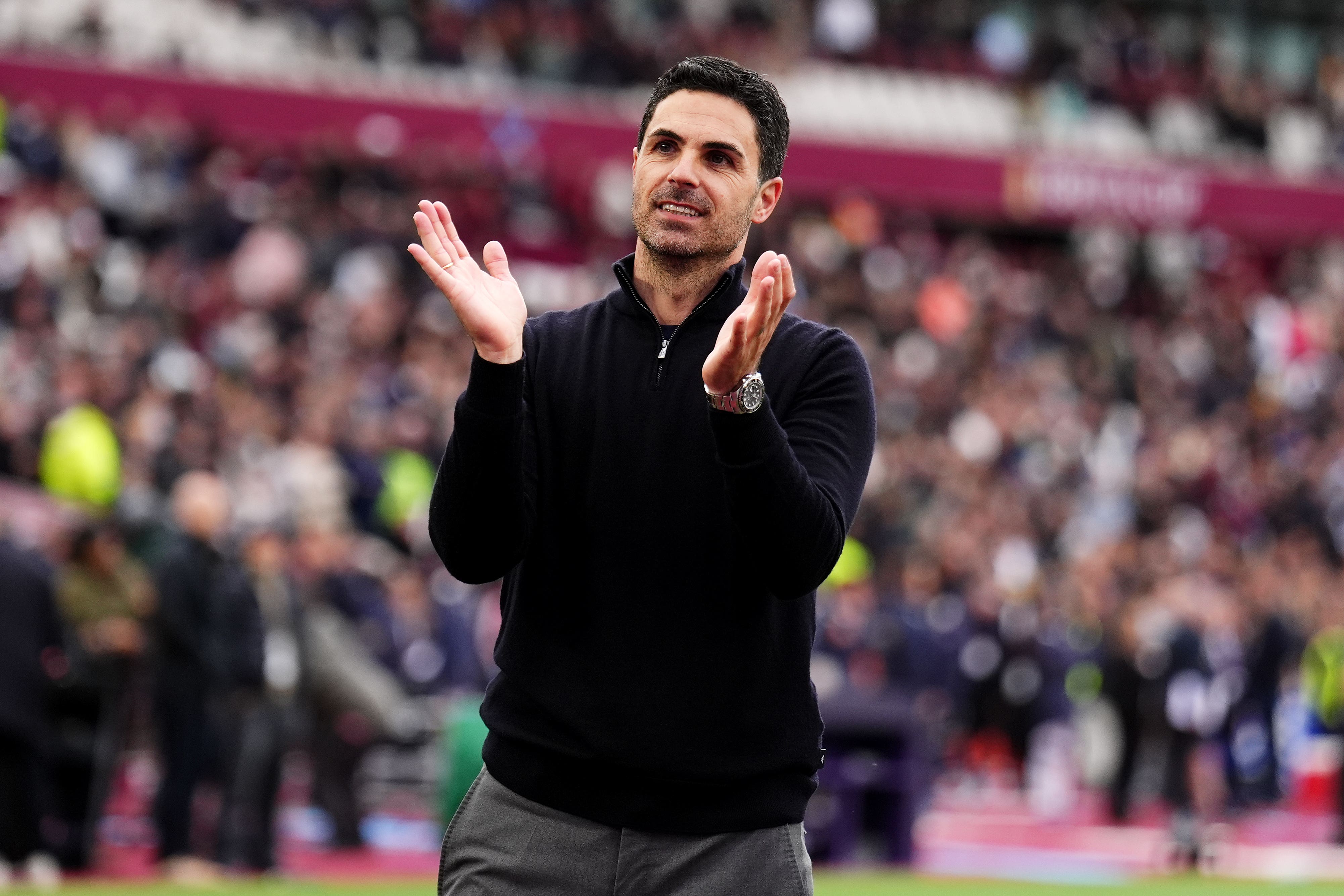 Arsenal manager Mikel Arteta celebrates after the win at West Ham (PA)