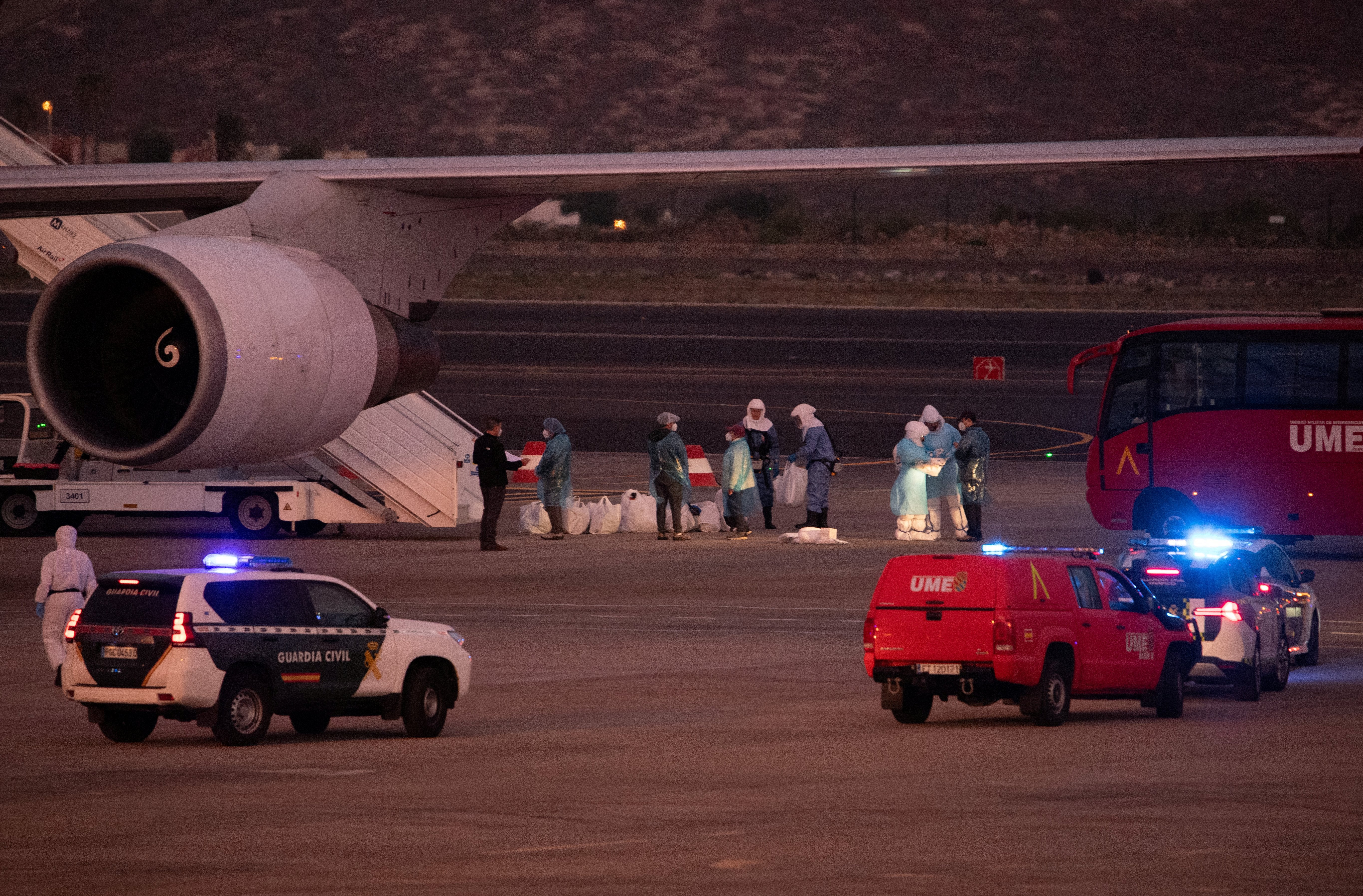 Passengers board a plane bound for US carrying passengers evacuated from the Dutch flagged hantavirus-stricken cruise ship MV Hondius at the Tenerife Sur-Reina Sofia airport on the island of Tenerife in Spain's Canary Islands on 10 May 2026