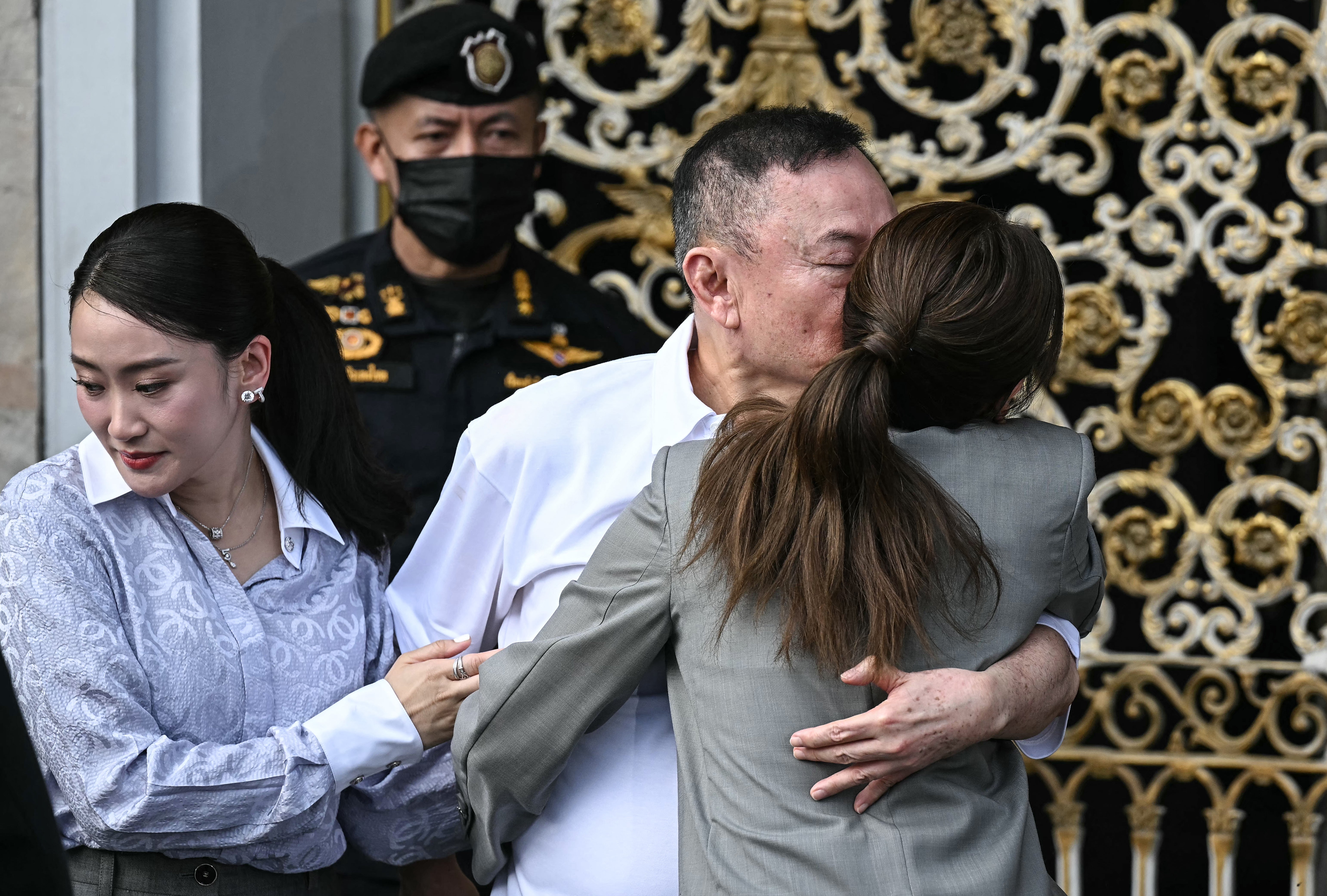 Thaksin Shinawatra hugs his daughters Paetongtarn Shinawatra after his release at Klong Prem Central Prison in Bangkok on 11 May 2026