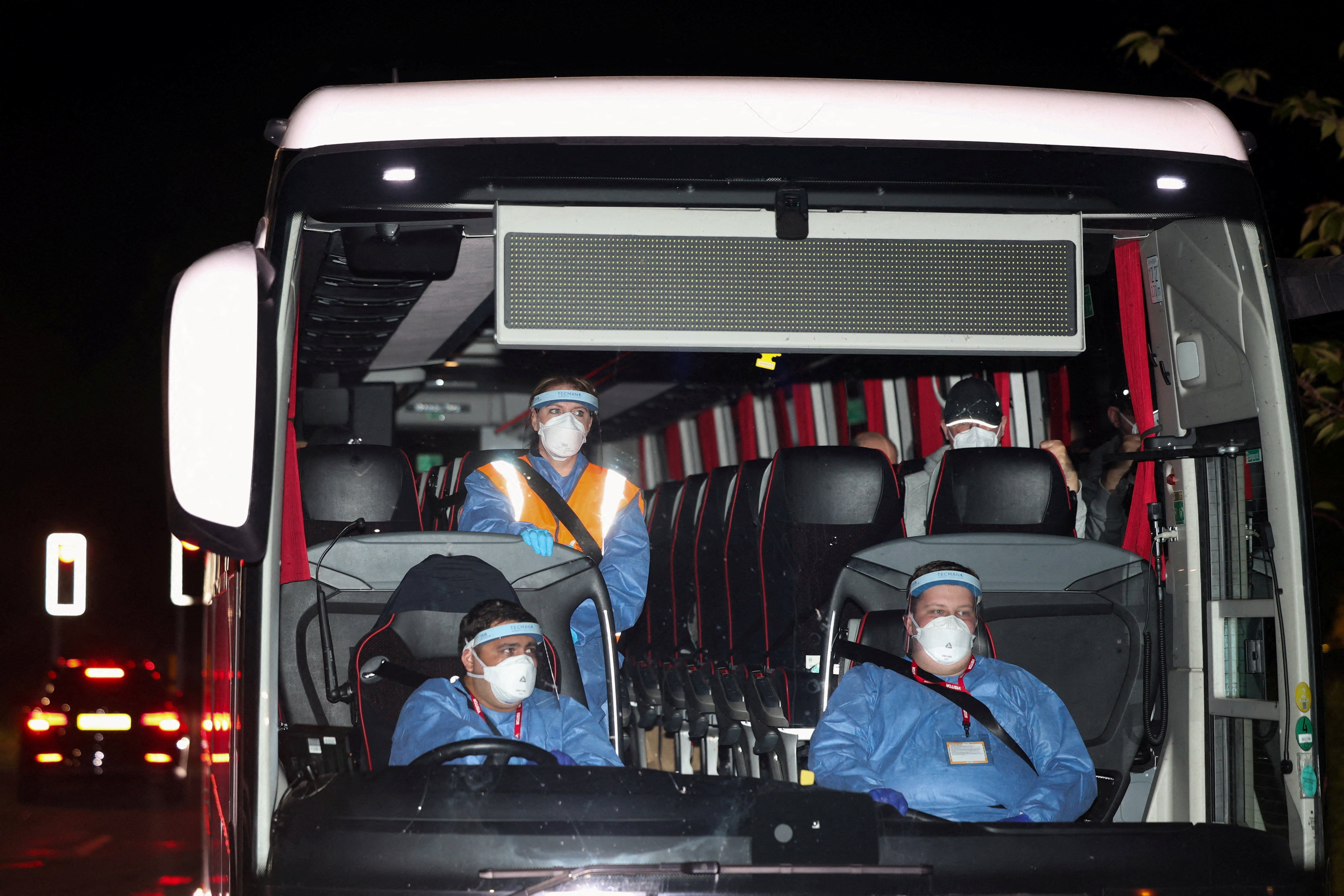 A bus transporting repatriated British nationals from the cruise ship MV Hondius, which was affected by a hantavirus outbreak, arrives at Arrowe Park Hospital, which will be used to house the repatriated, in Birkenhead, Britain, 10 May 2026