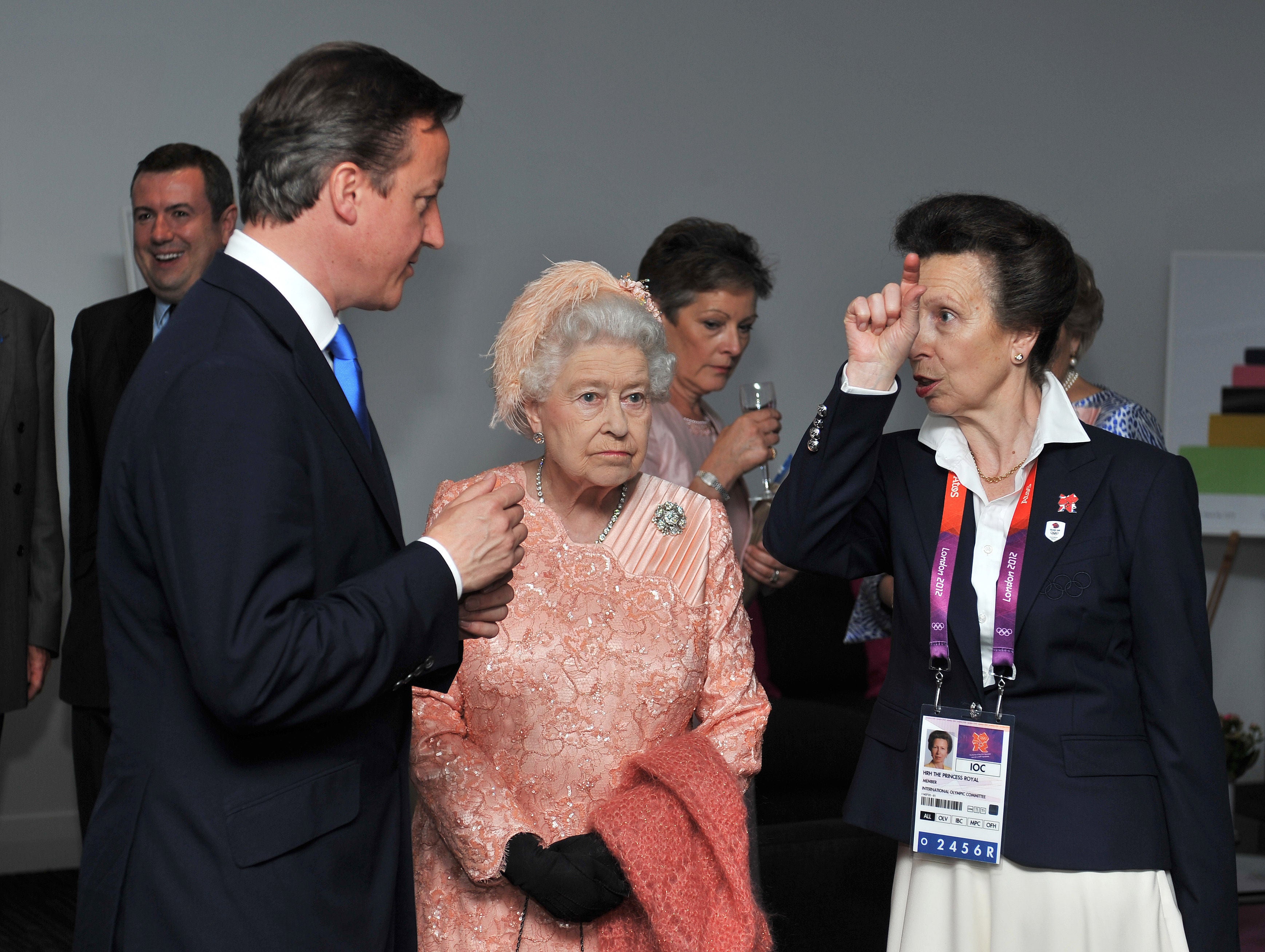 Queen Elizabeth II with the Princess Royal and Prime Minister David Cameron as they arrive for the Olympic Games 2012 Opening Ceremony at the Olympic Stadium, London