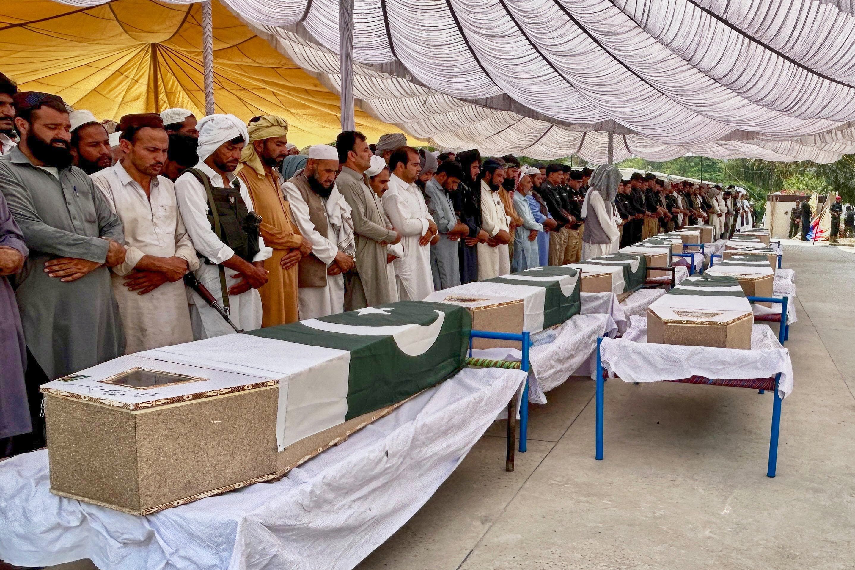 People offer funeral prayers for the police officers who were killed in the suicide bombing at a security post in Fatah Khel in Pakistan's Khyber Pakhtunkhwa province on 10 May 2026