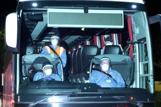 Coaches arriving at Arrowe Park Hospital on Merseyside (PA)