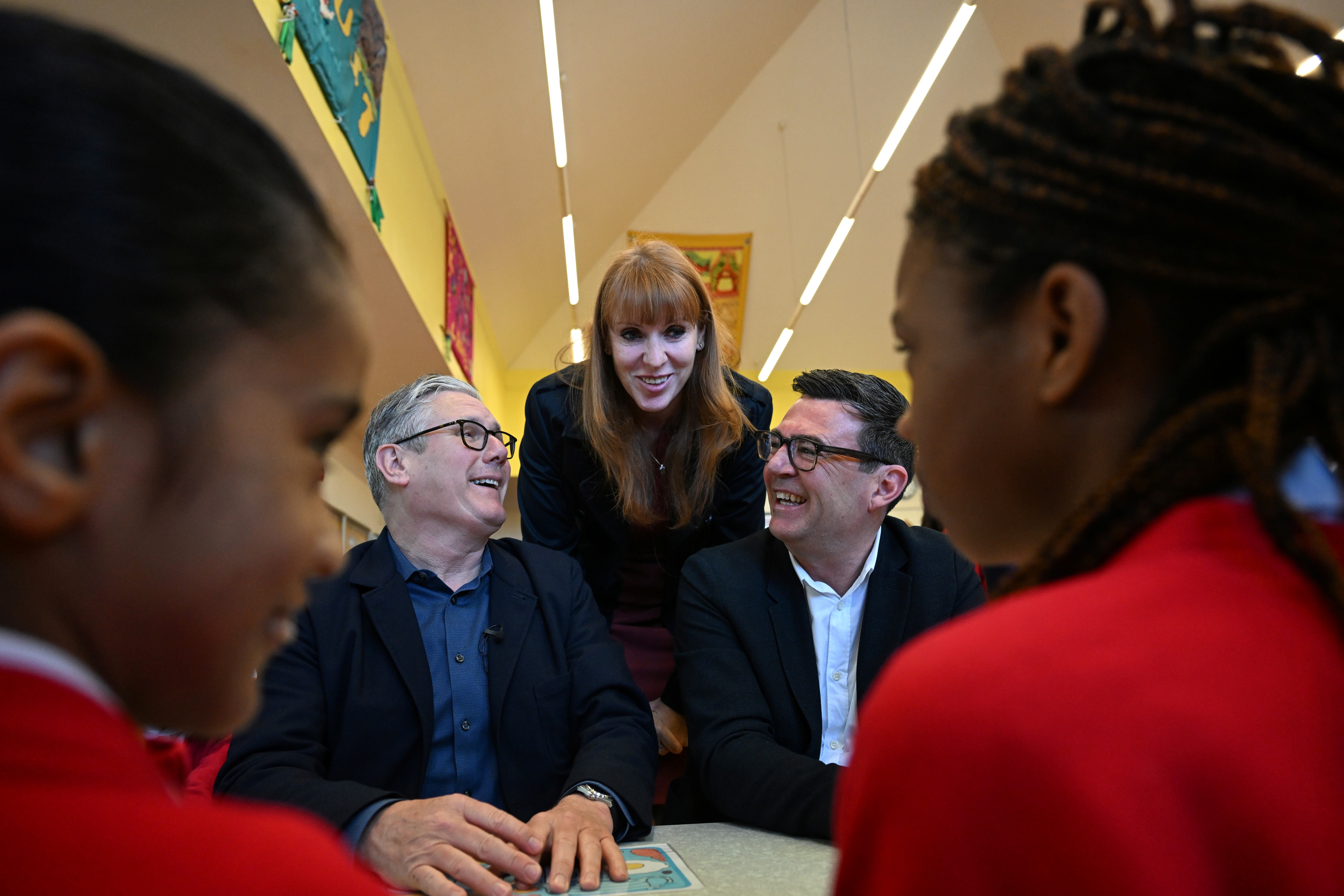 Sir Keir Starmer, Andy Burnham and fellow leadership candidate Angela Rayner meet pupils during a visit to a school breakfast club