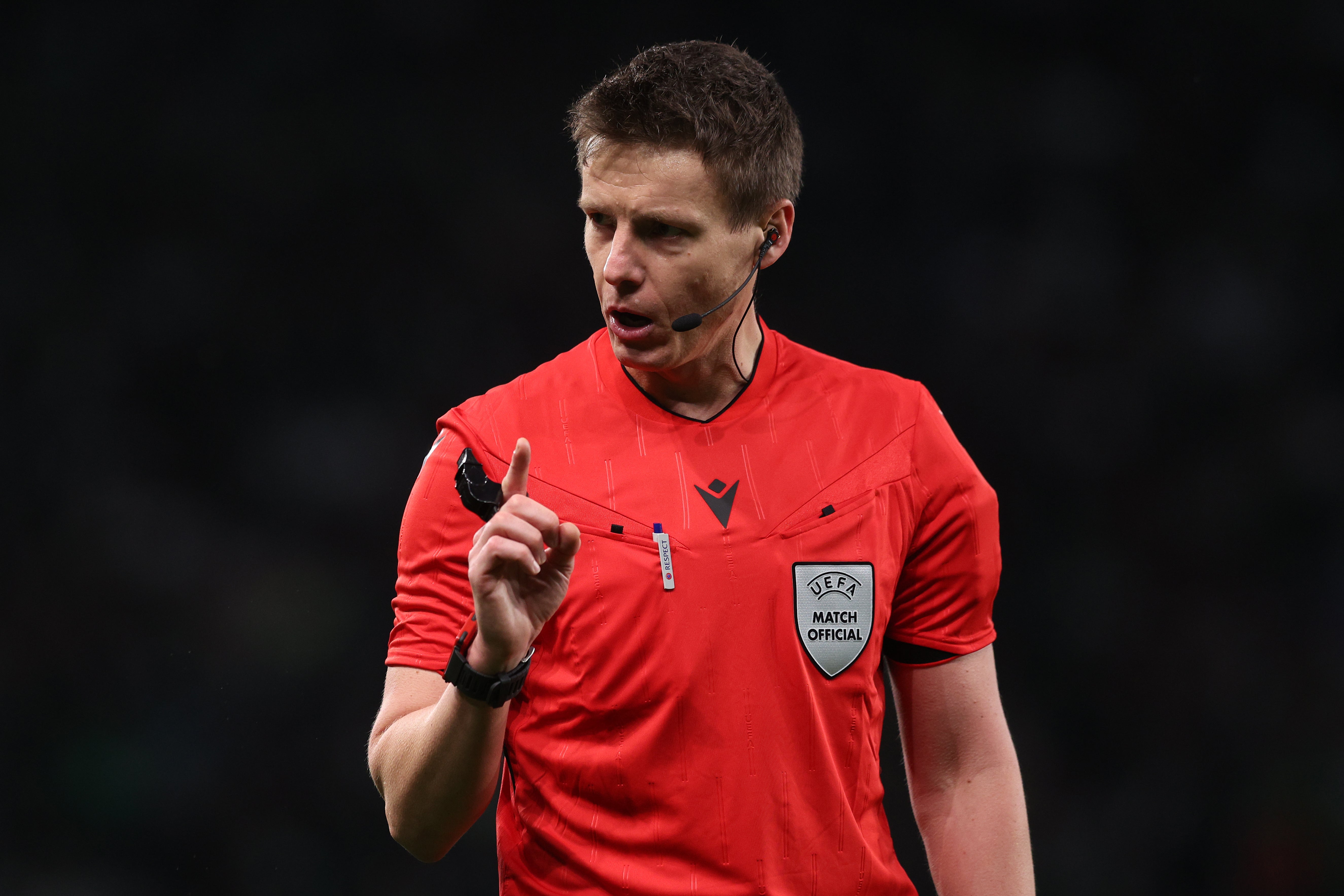 Referee Daniel Siebert gestures during Sporting v Arsenal in the Champions League quarter-finals