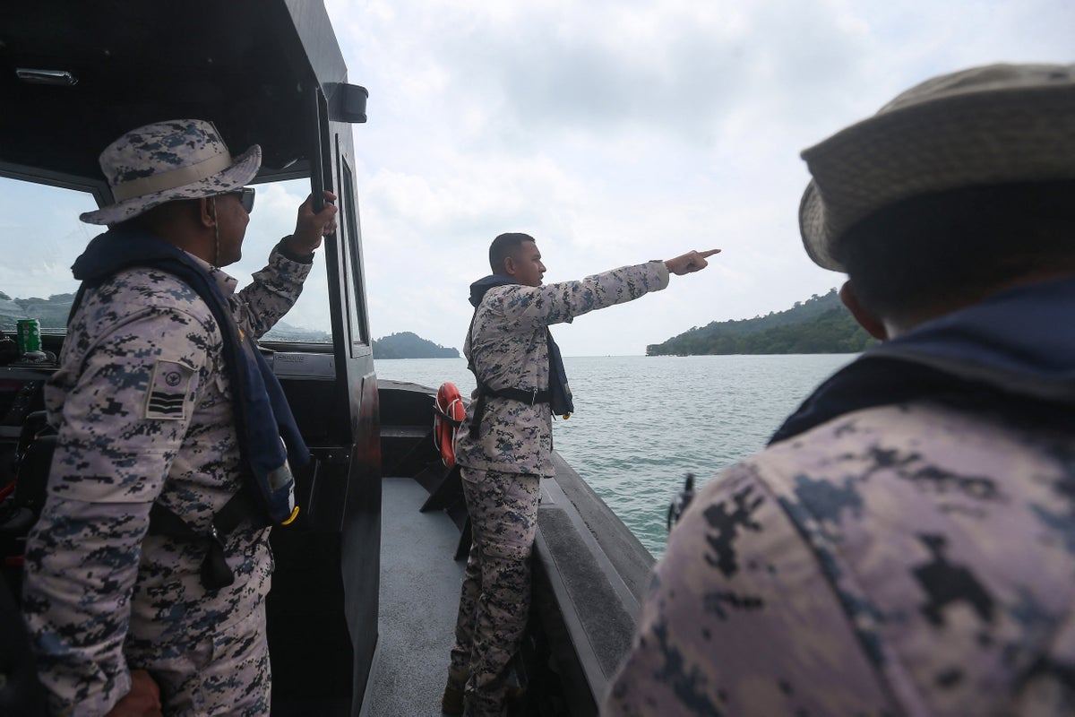 Fourteen missing after boat carrying 37 migrants sinks off Malaysia