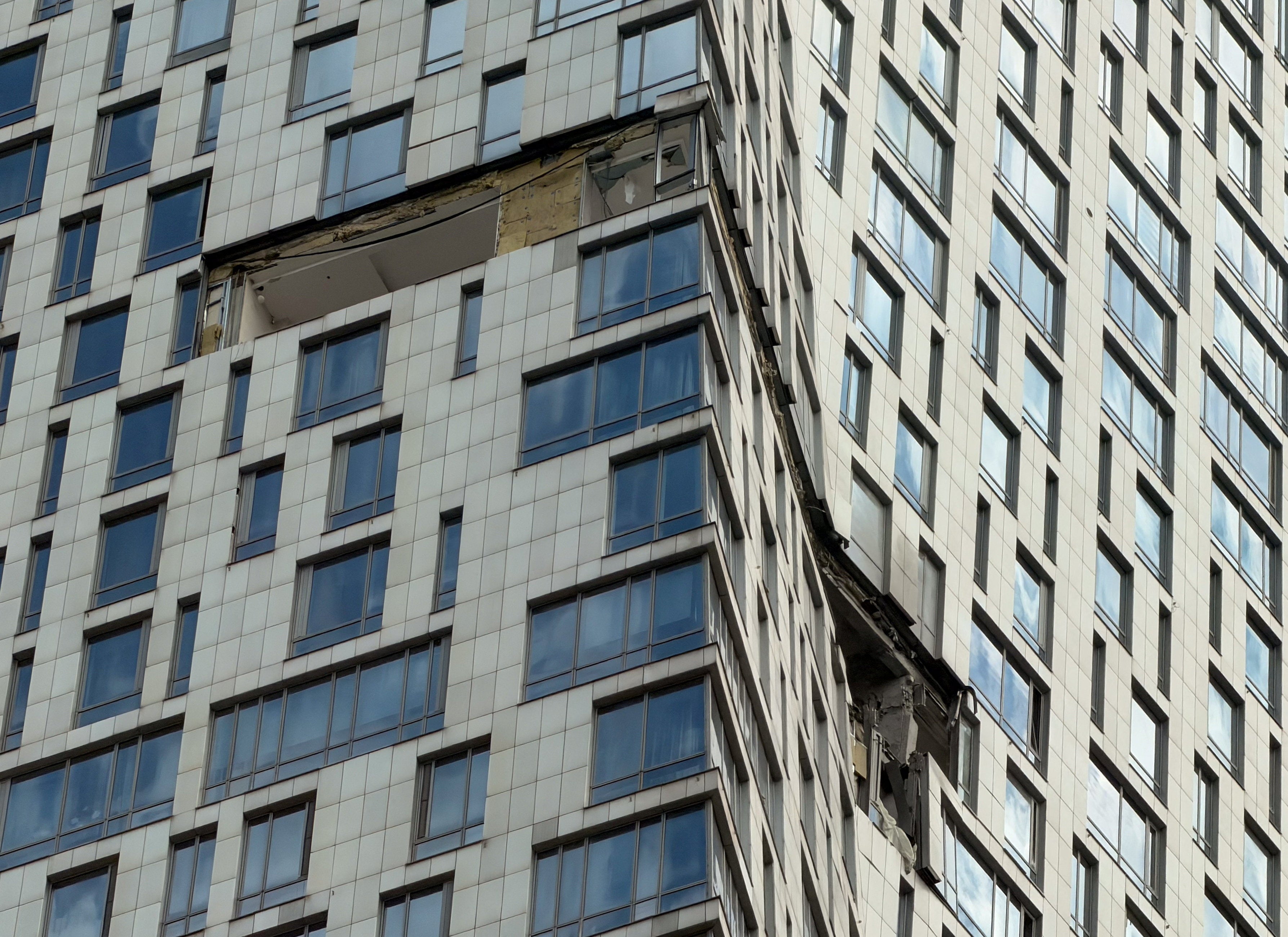 The damaged facade of a high-rise building attacked by Ukrainian drones in Moscow in early May