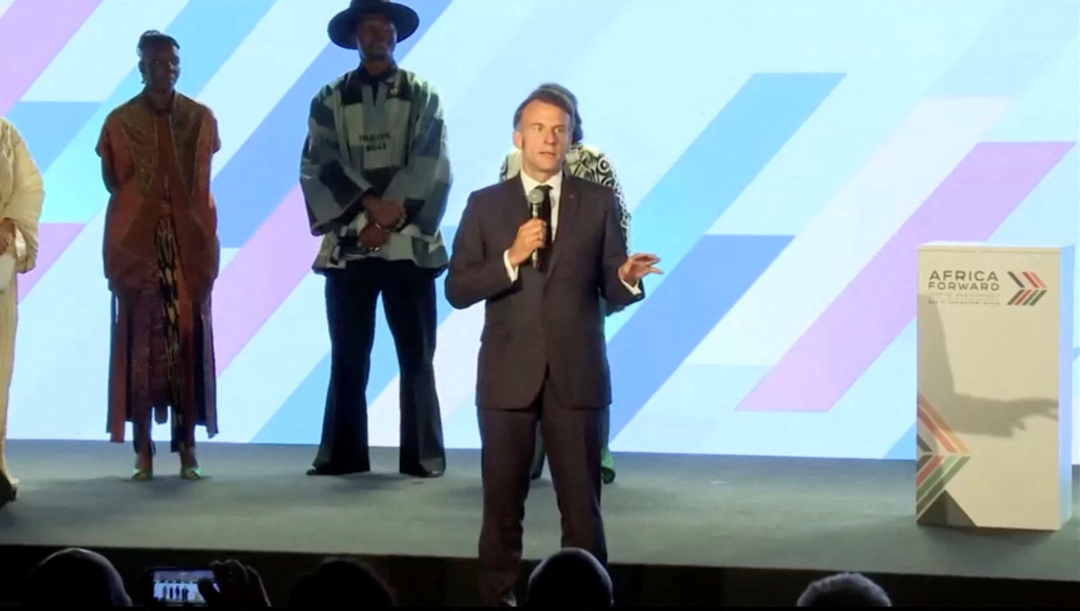 French president Emmanuel Macron asks guests to pipe down a discussion at the ’Africa Forward: Creation in Motion’ event