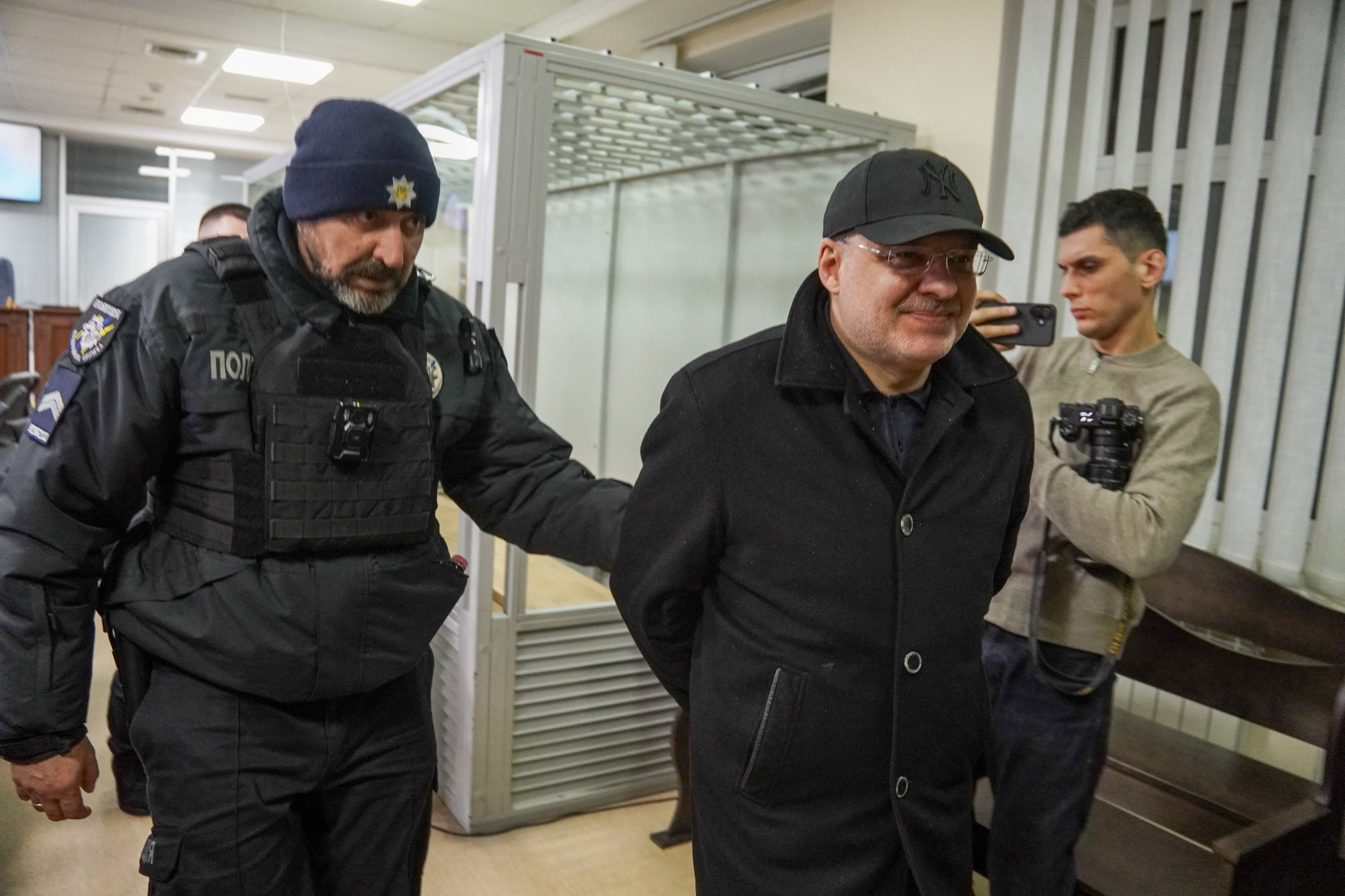 Former Energy Minister Herman Galushchenko (C) leaves after a court hearing over his detention