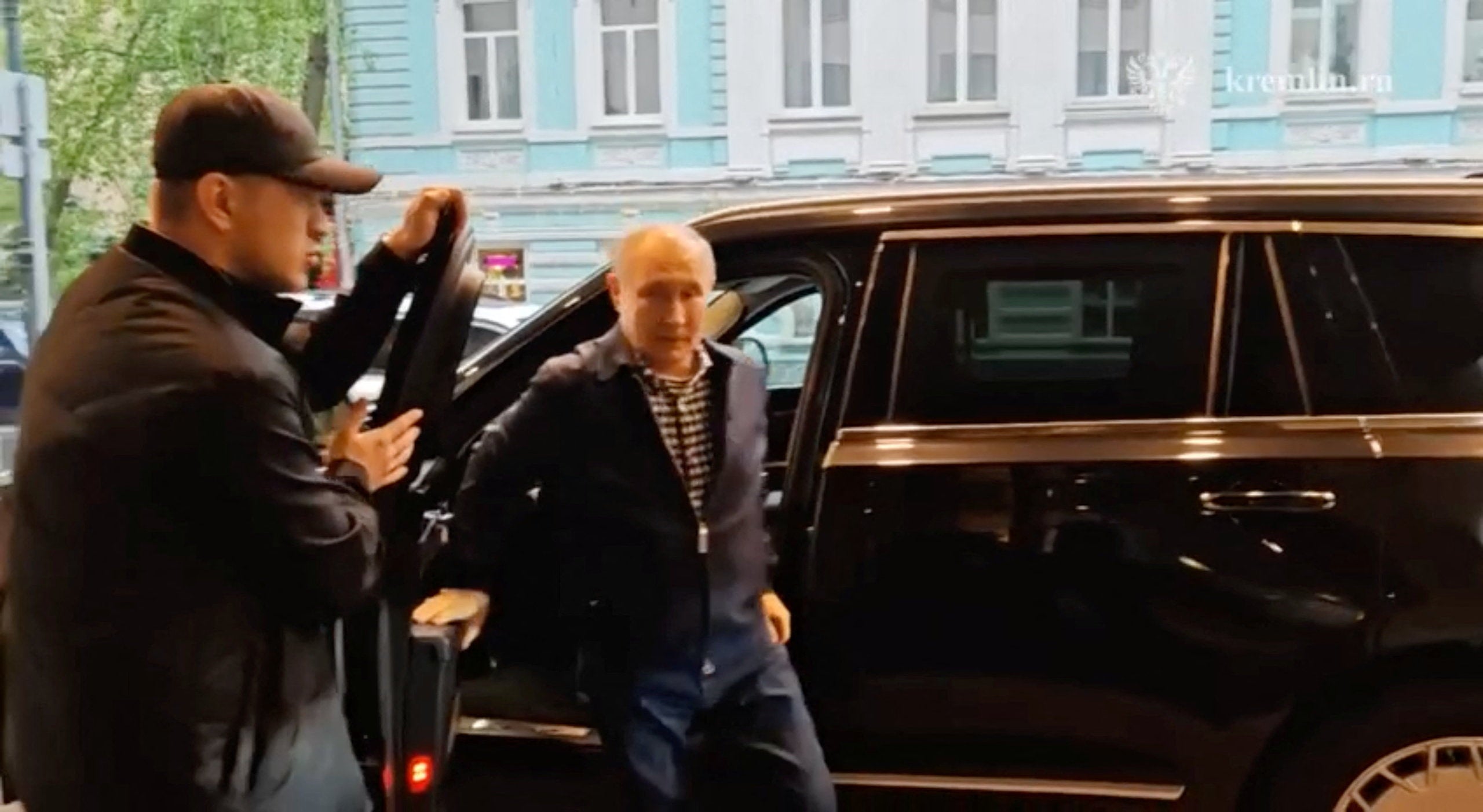 Russian President Vladimir Putin arrives for a meeting with his former school teacher