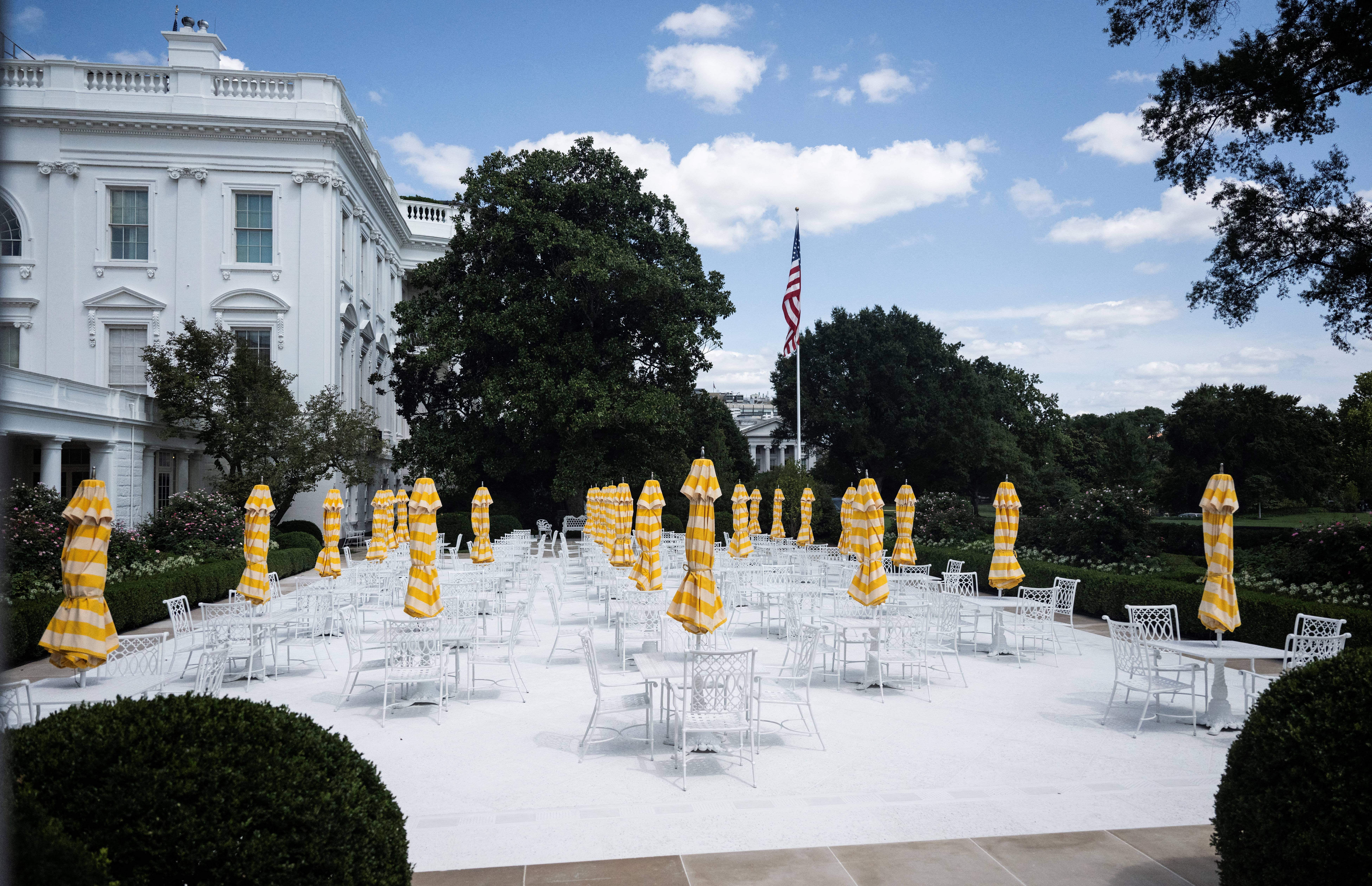 Among the many changes Trump made to the White House was the transformation of the Rose Garden, where grass and flower beds were replaced with a paved surface and patio furniture