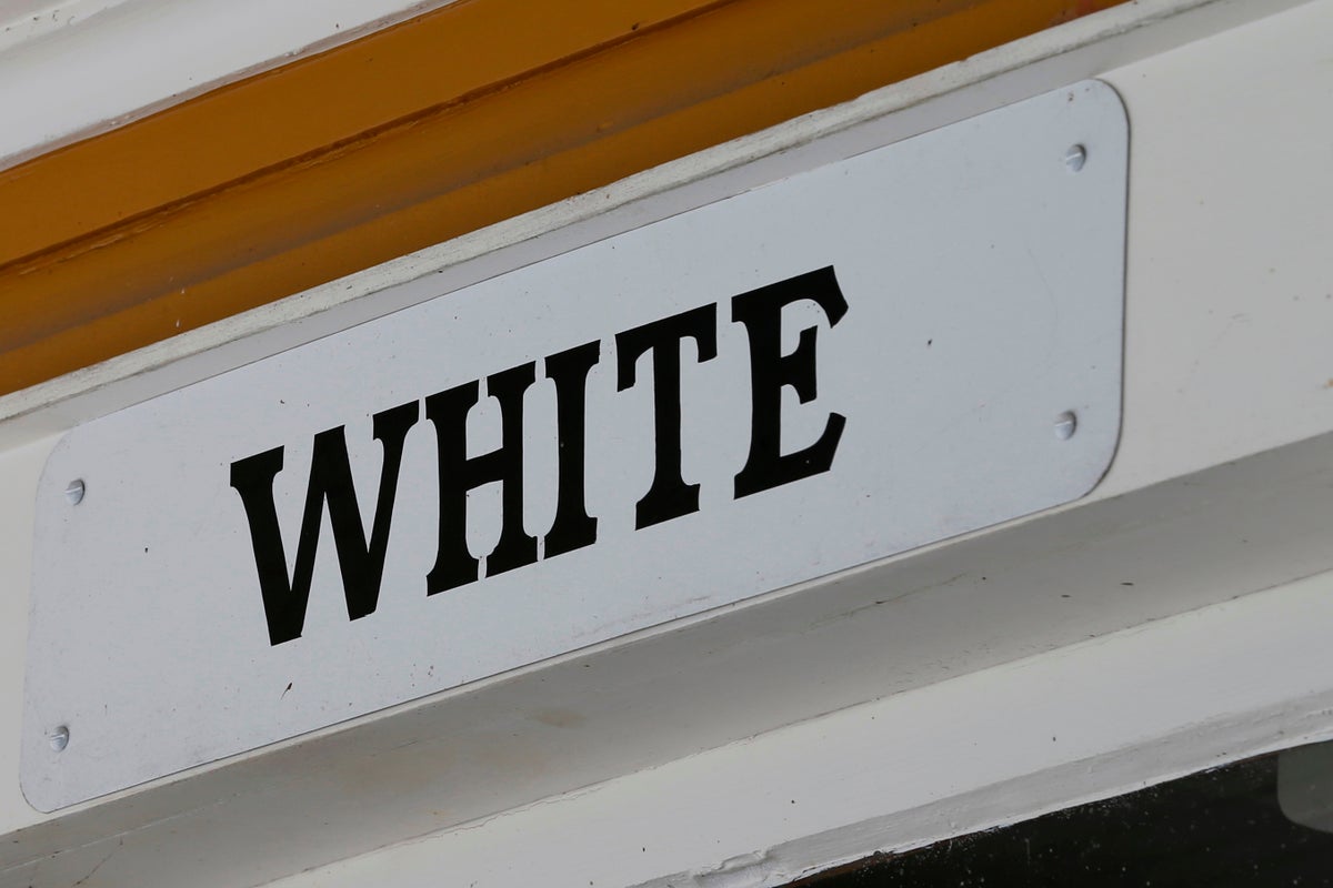 Separate and unequal: The 'Whites Only' sign was a visible reminder of American racism