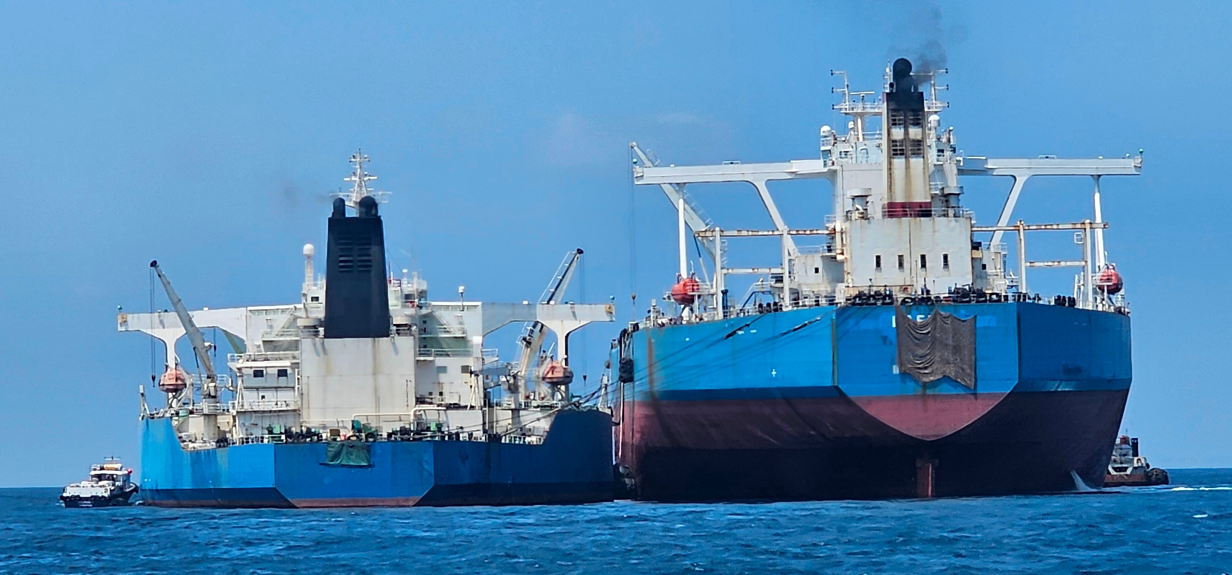 This handout photo from United Against Nuclear Iran shows two oil tankers making a ship-to-ship transfer of Iranian oil