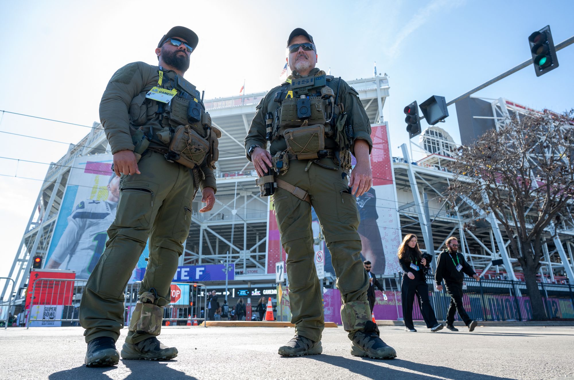 Federal immigration agents may be deployed to World Cup sites to assist with security, according to a new report. Pictured here, agents stand outside Levi's Stadium ahead of Super Bowl LX in Santa Clara, California