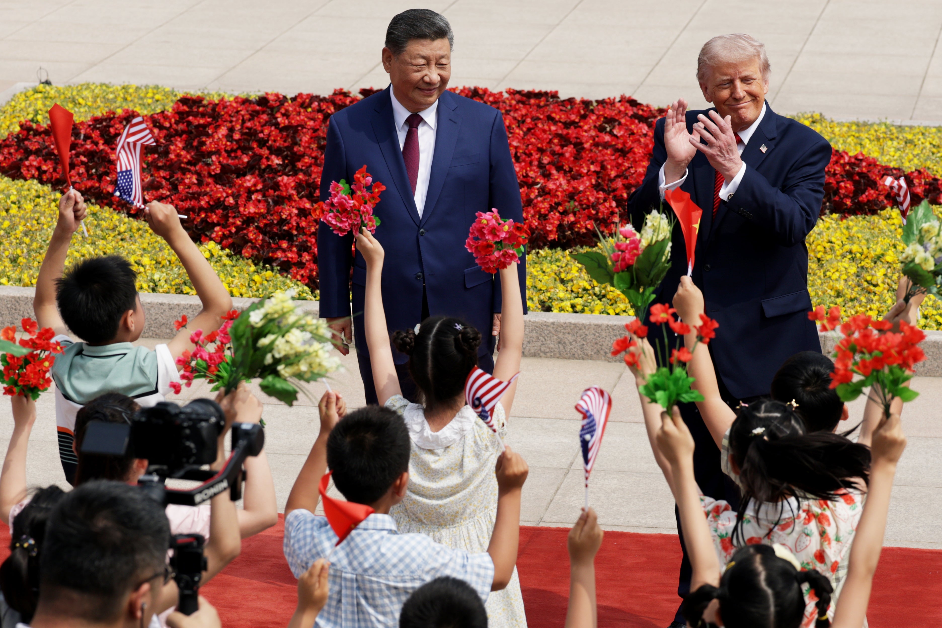 Xi Jinping and Donald Trump are entertained by schoolchildren at the Great Hall of the People in Beijing