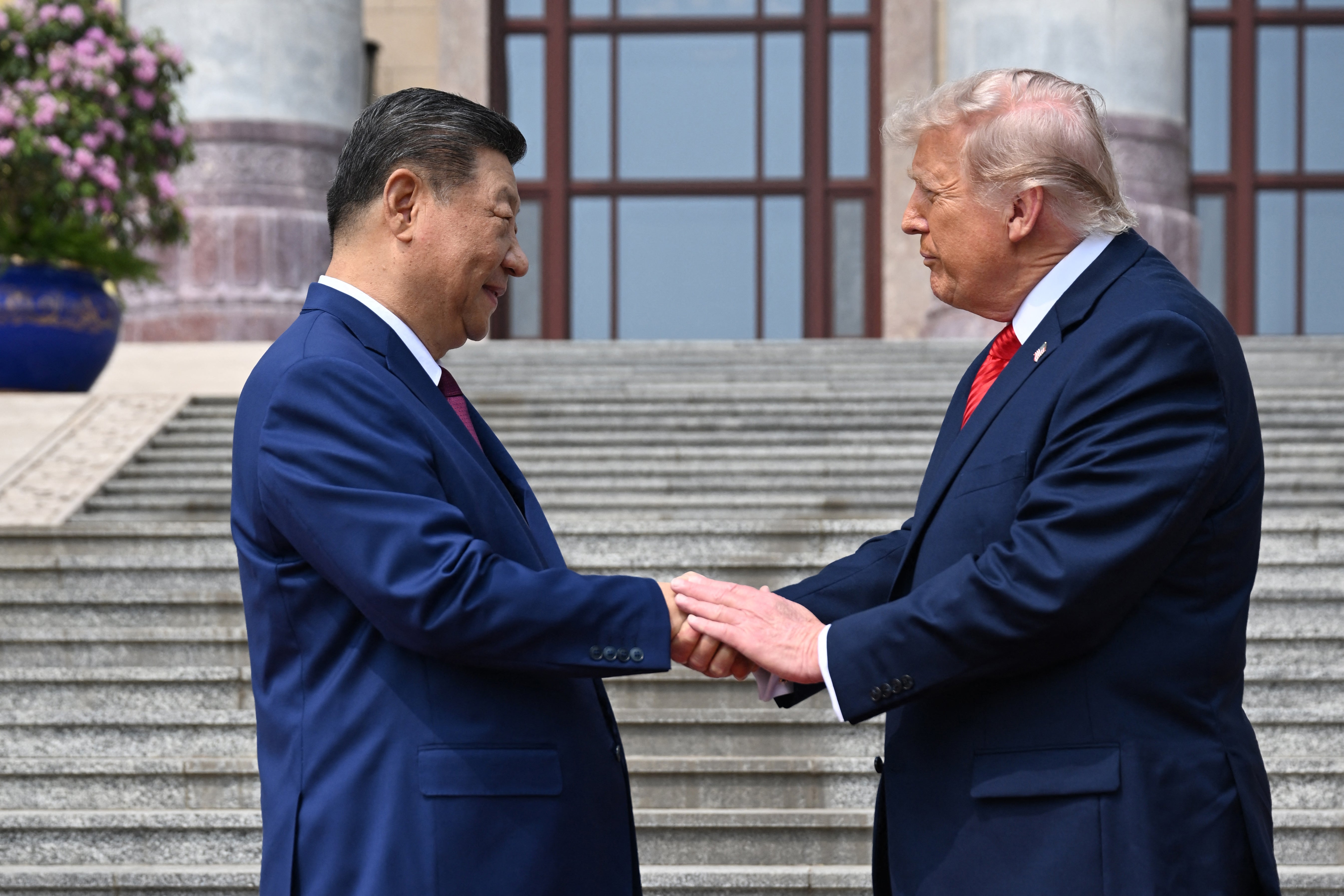 Trump patted his host’s hand gently five times in a gesture that could be interpreted as warmth or an attempt to seize control of the dynamic