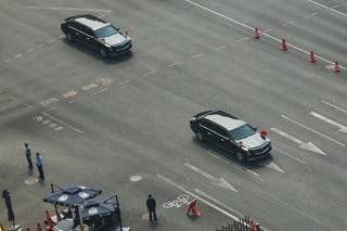 Motorcade that is believed to be carrying U.S. President Donald Trump travels on Chang'an Avenue in Beijing