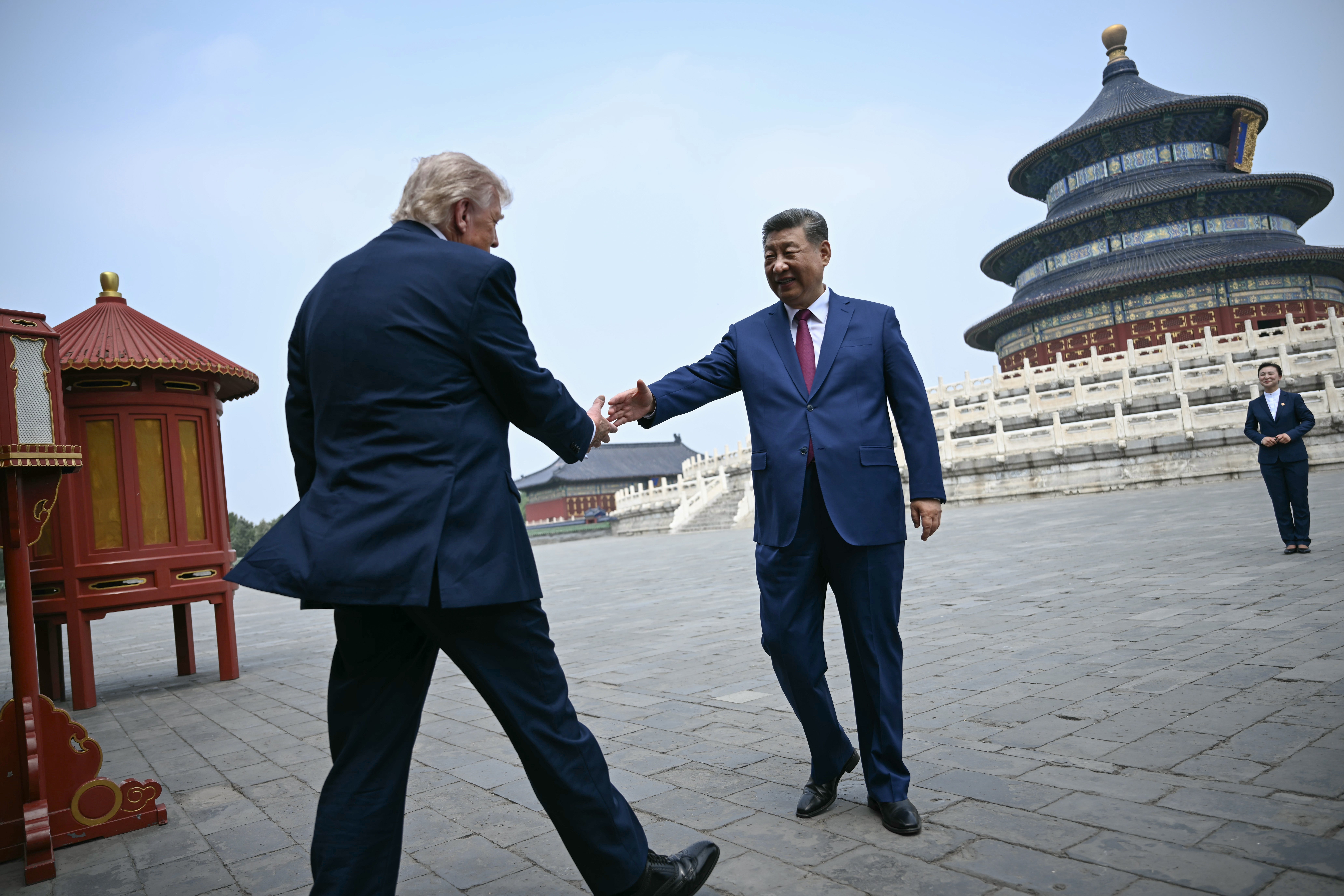 Xi Jinping shakes hands with Donald Trump in Beijing