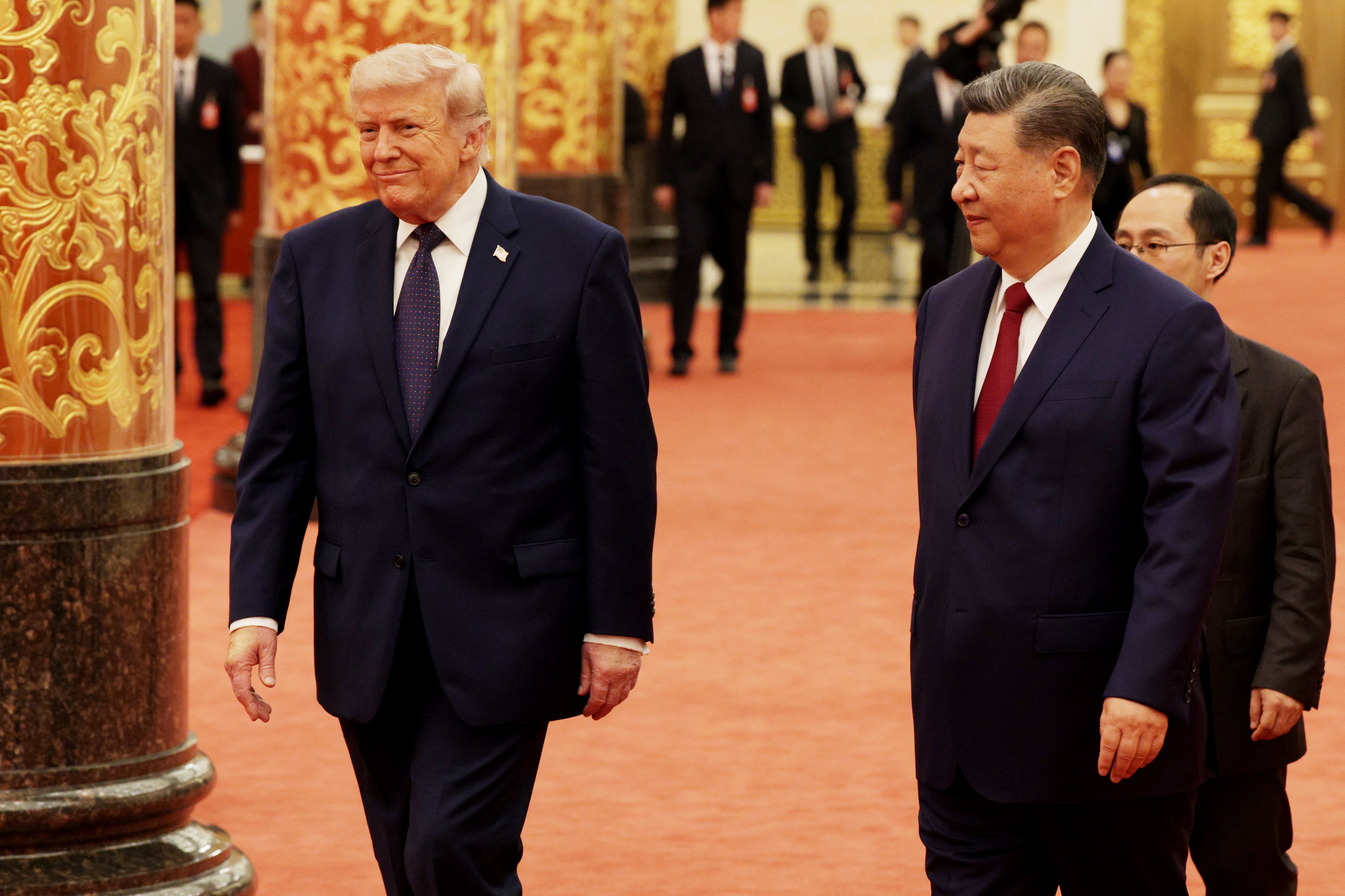 Donald Trump arrives for a state banquet hosted by Xi Jinping at the Great Hall of the People on 14 May 2026