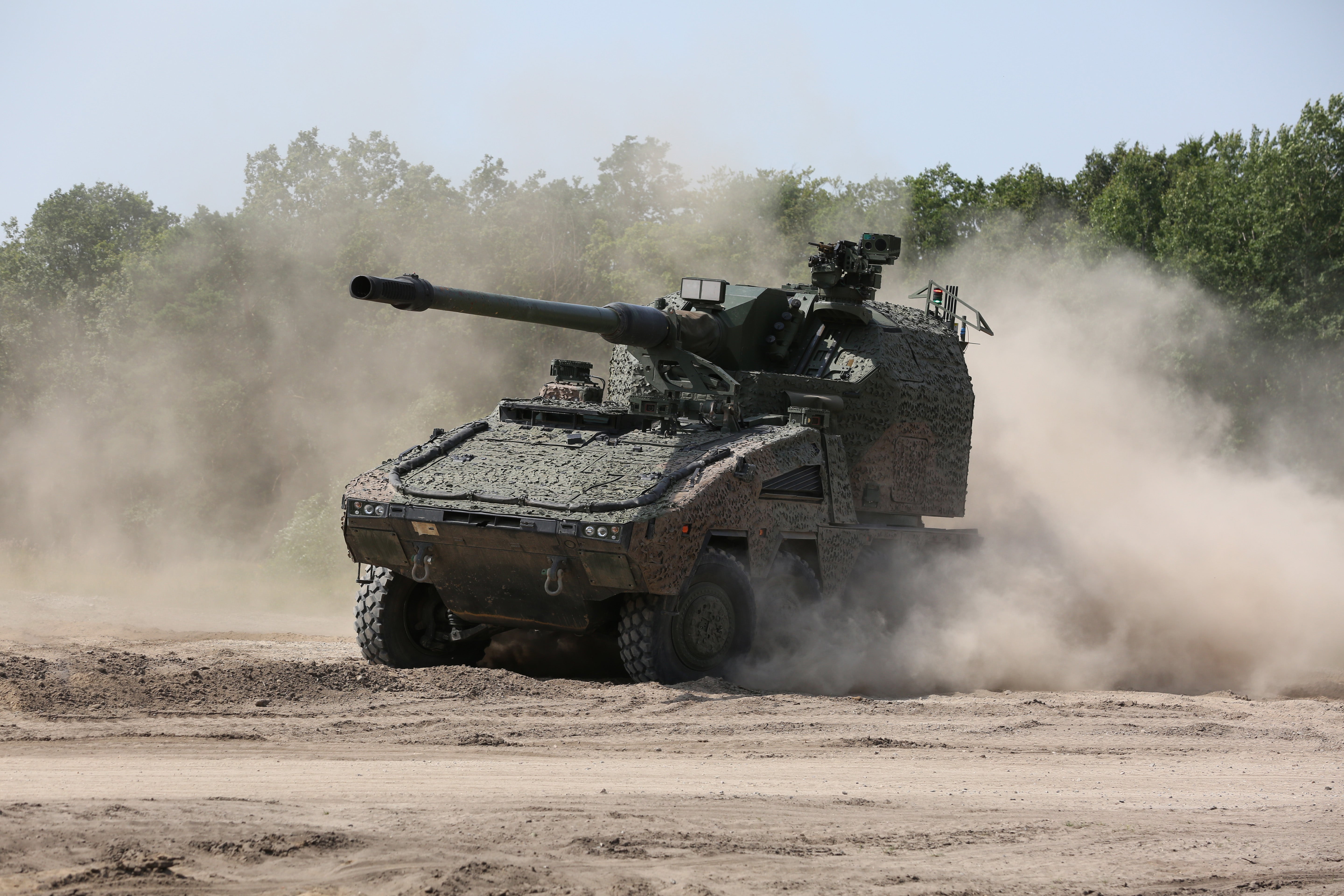 The guns, pictured on trial here in Germany, will be manufactured on British soil