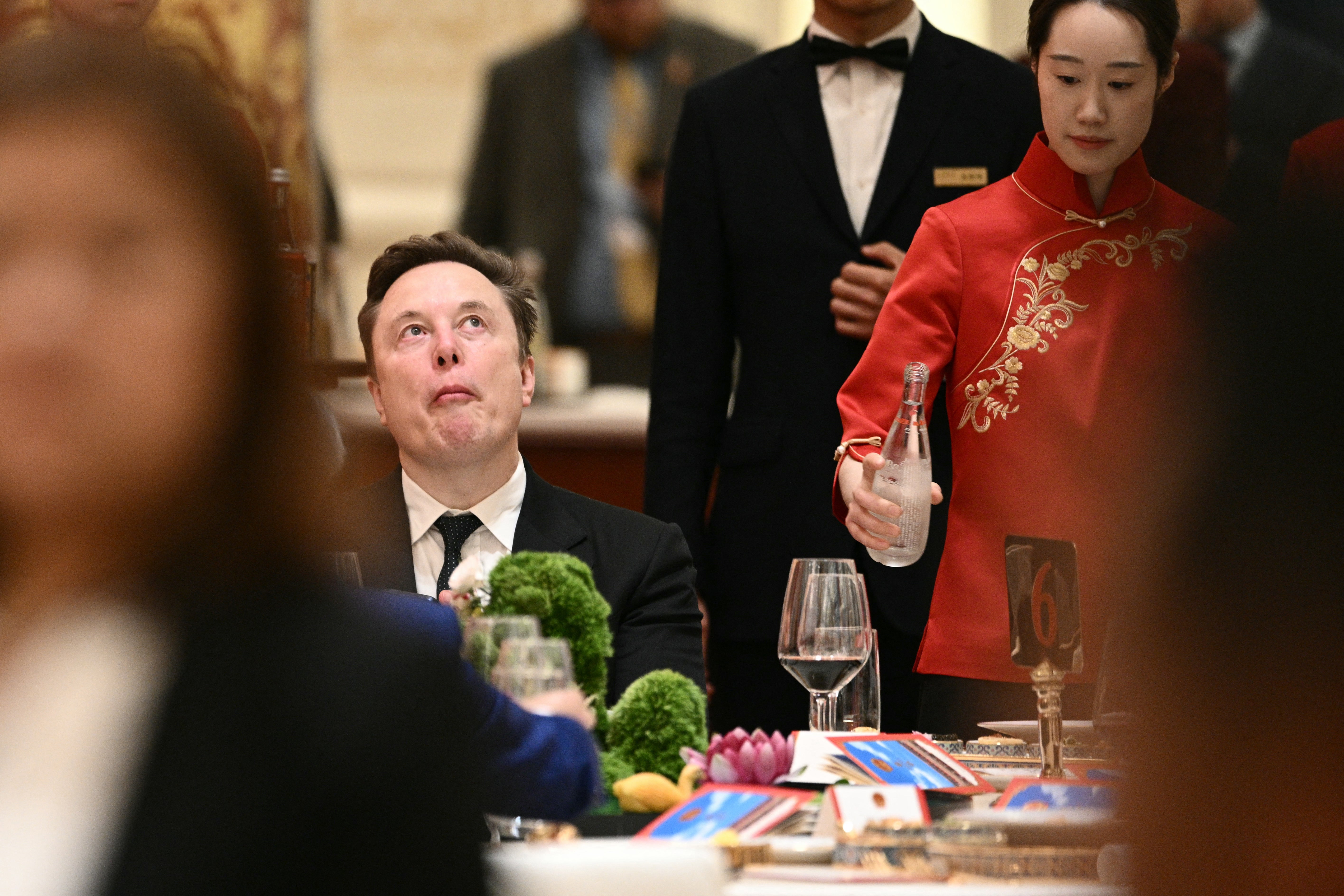 Elon Musk couldn't resist tucking in before the banquet got underway