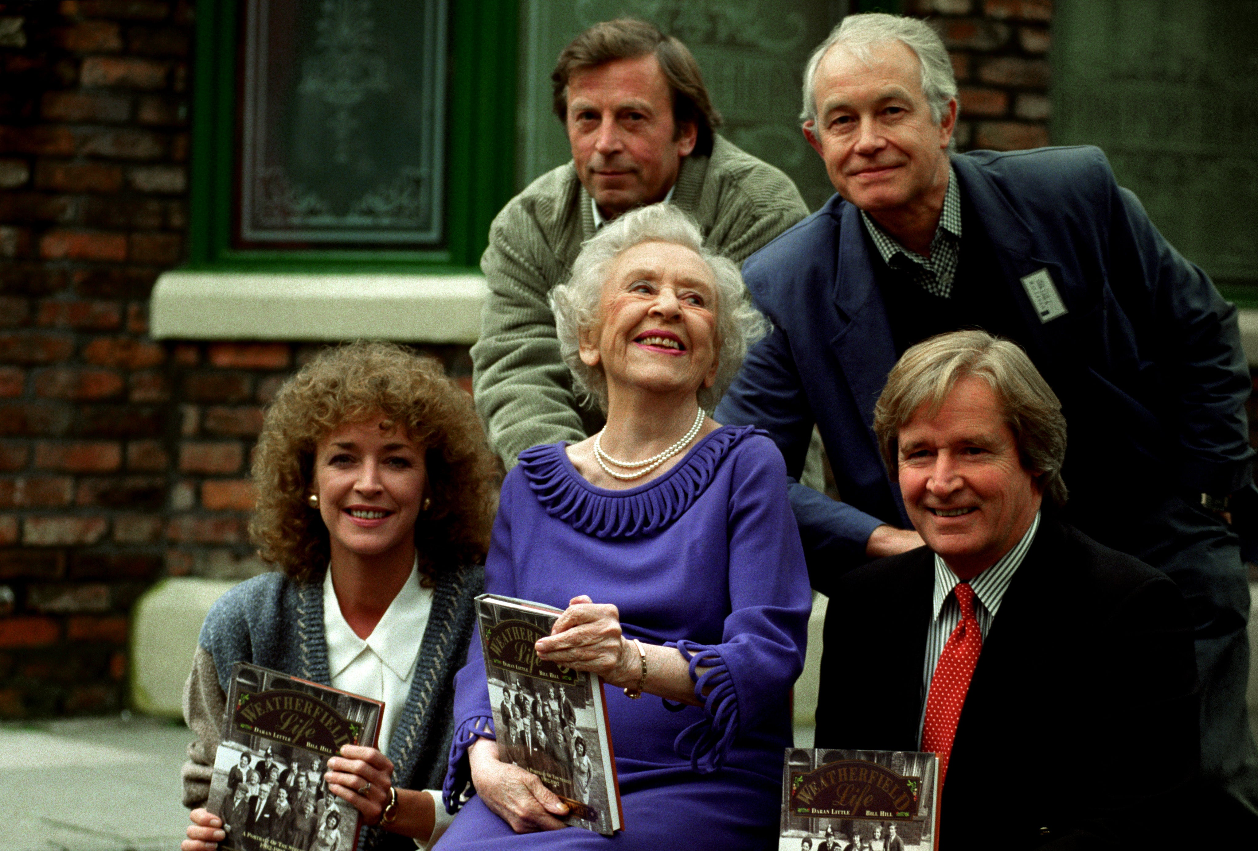 Ken Farrington (Billy Walker), and Alan Rothwell (David Walker). (L-R Front) Anne Kirkbride (Deirdre Barlow), Doris Speed (Annie Walker), and Bill Roache (Ken Barlow)