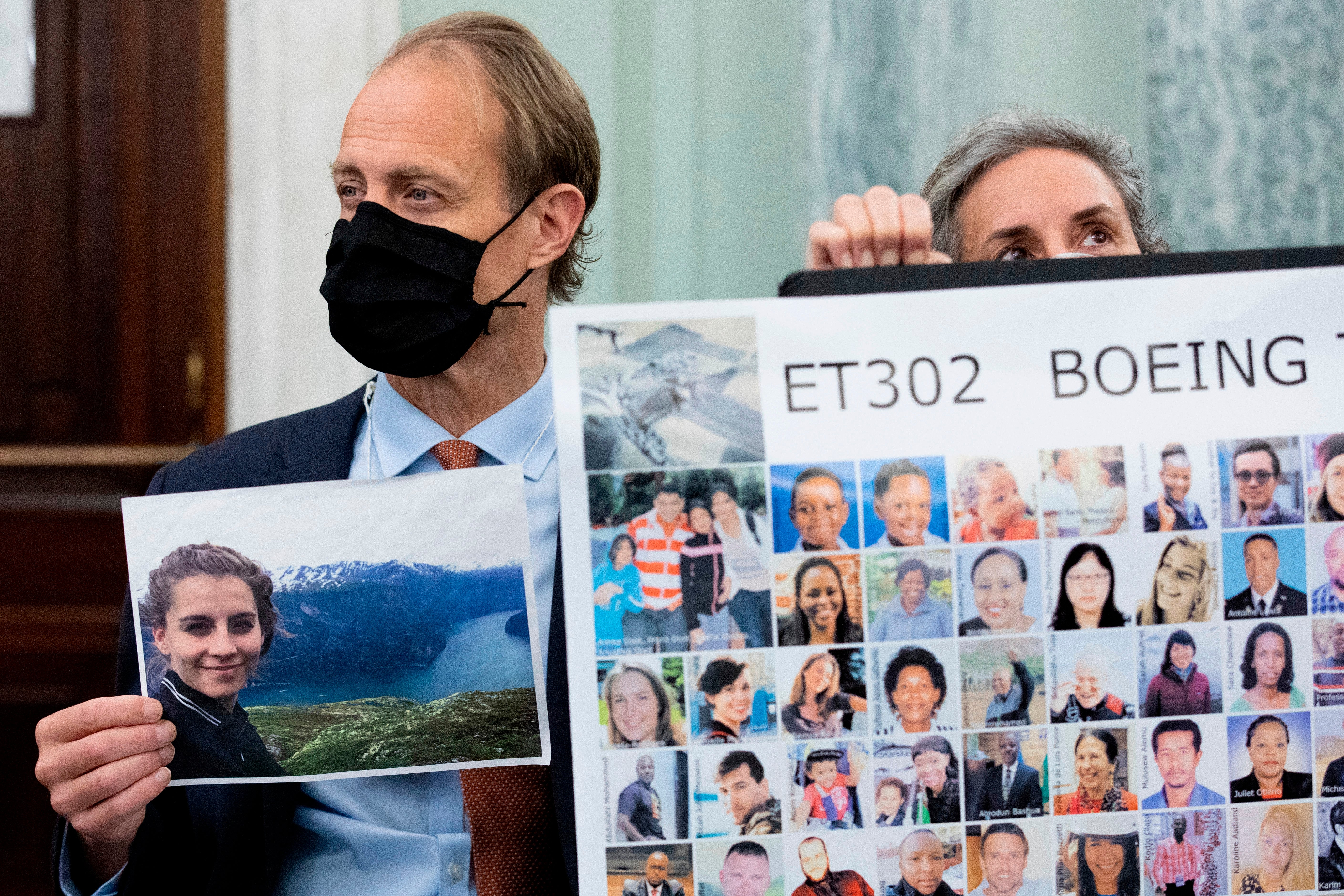 Michael Stumo, holding a photo of his daughter Samya Stumo, and his wife Nadia Milleron, sit behind FAA Administrator Steve Dickson during a Senate Committee