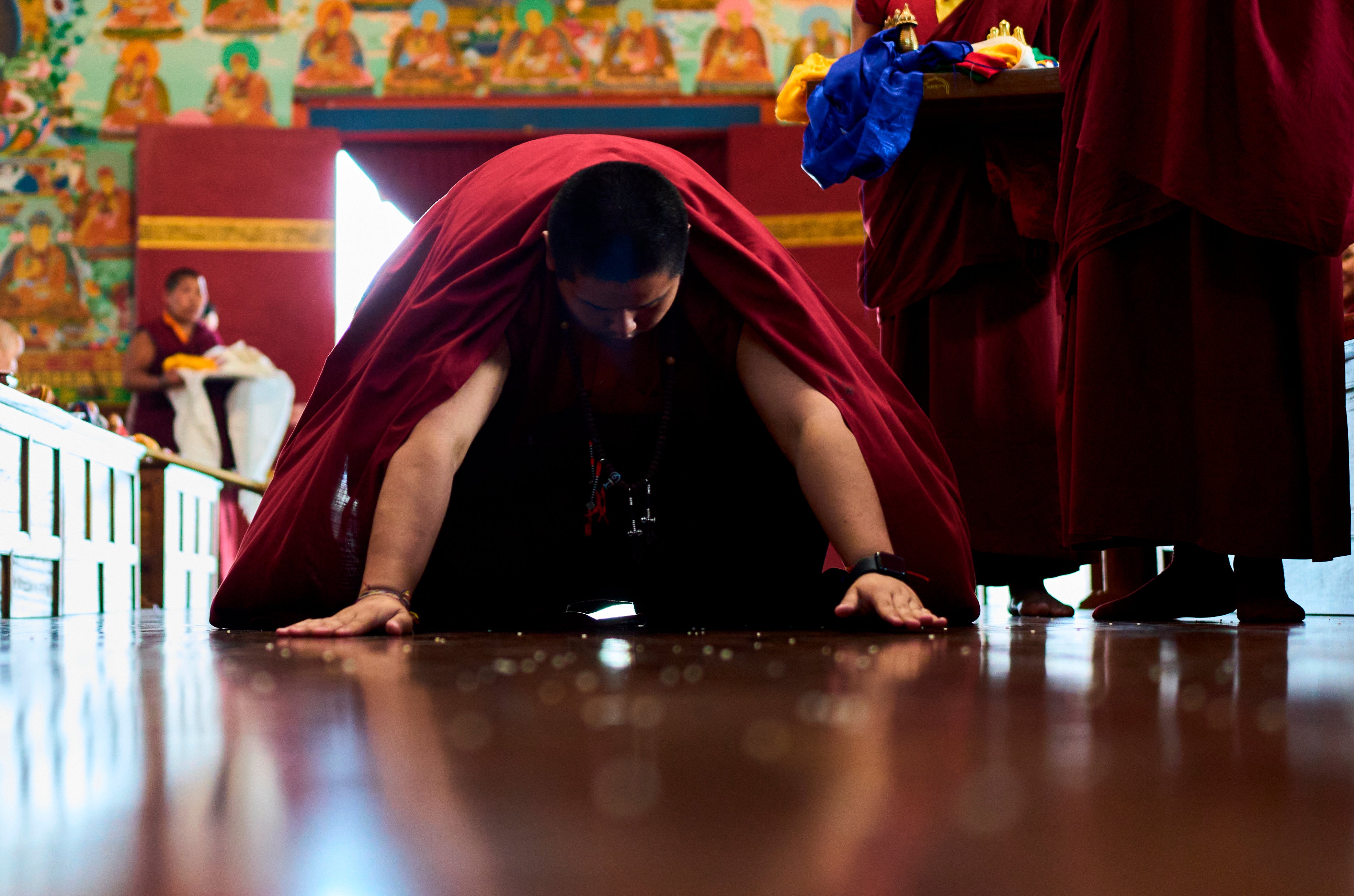 Jalue Dorje offers prayers during a ritual with other monks at Dzarong Thubten Mindrol Dongä Monastery in Kathmandu, Nepal
