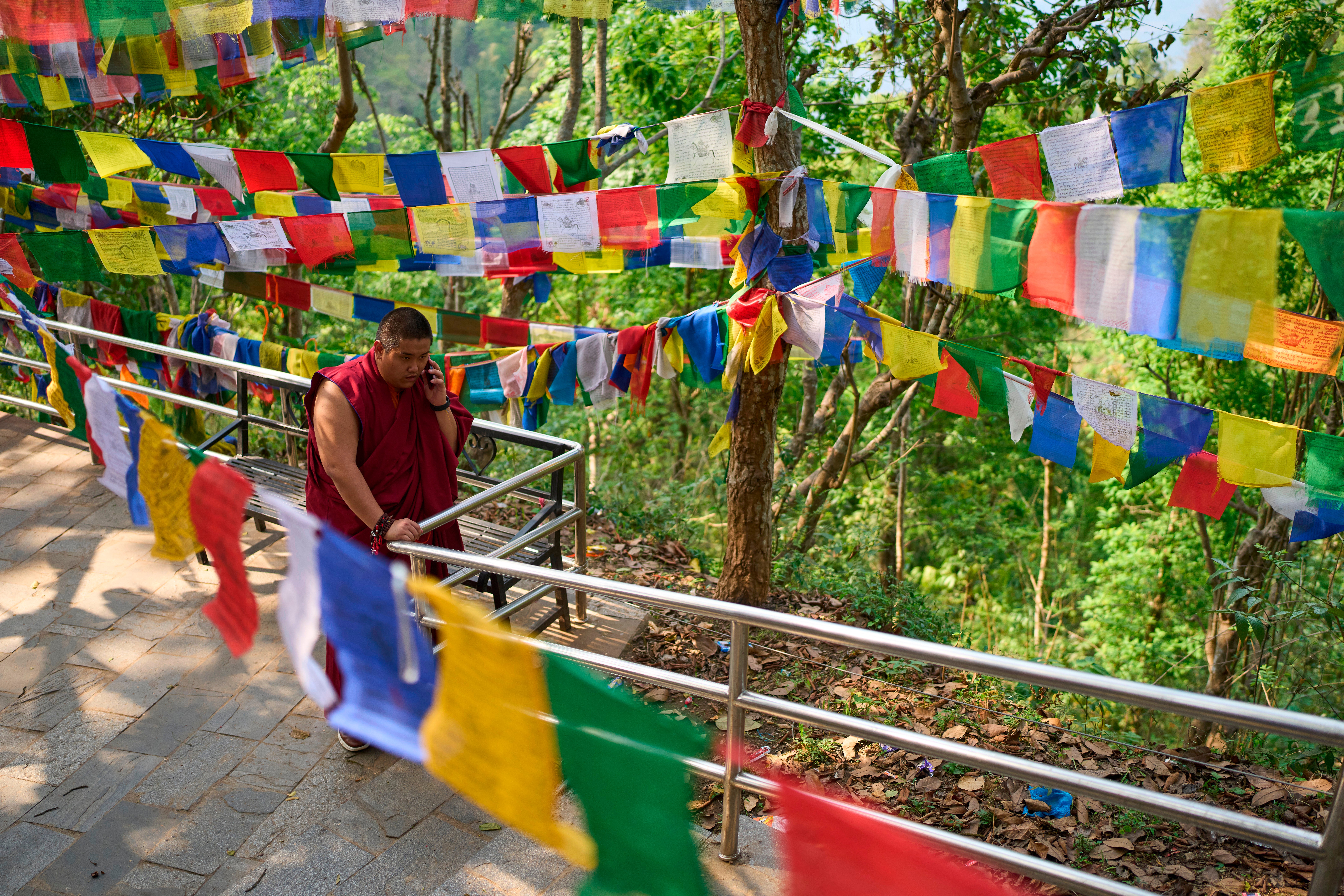 Jalue Dorje speaks on the phone during a visit to Maratika Caves, in eastern Nepal