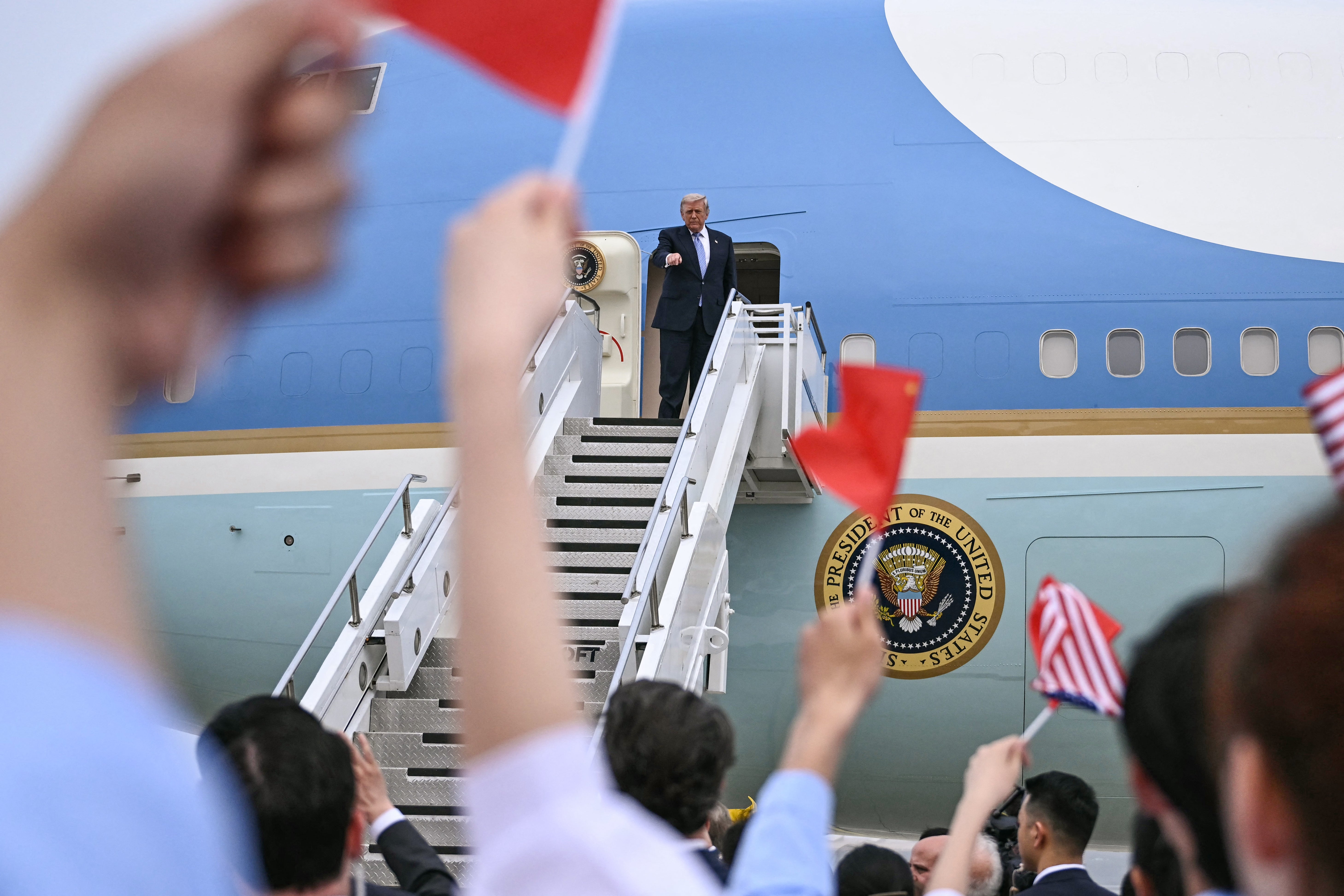 US President Donald Trump boards Air Force One before his departure from Beijing Capital Airport (AFP/Getty)