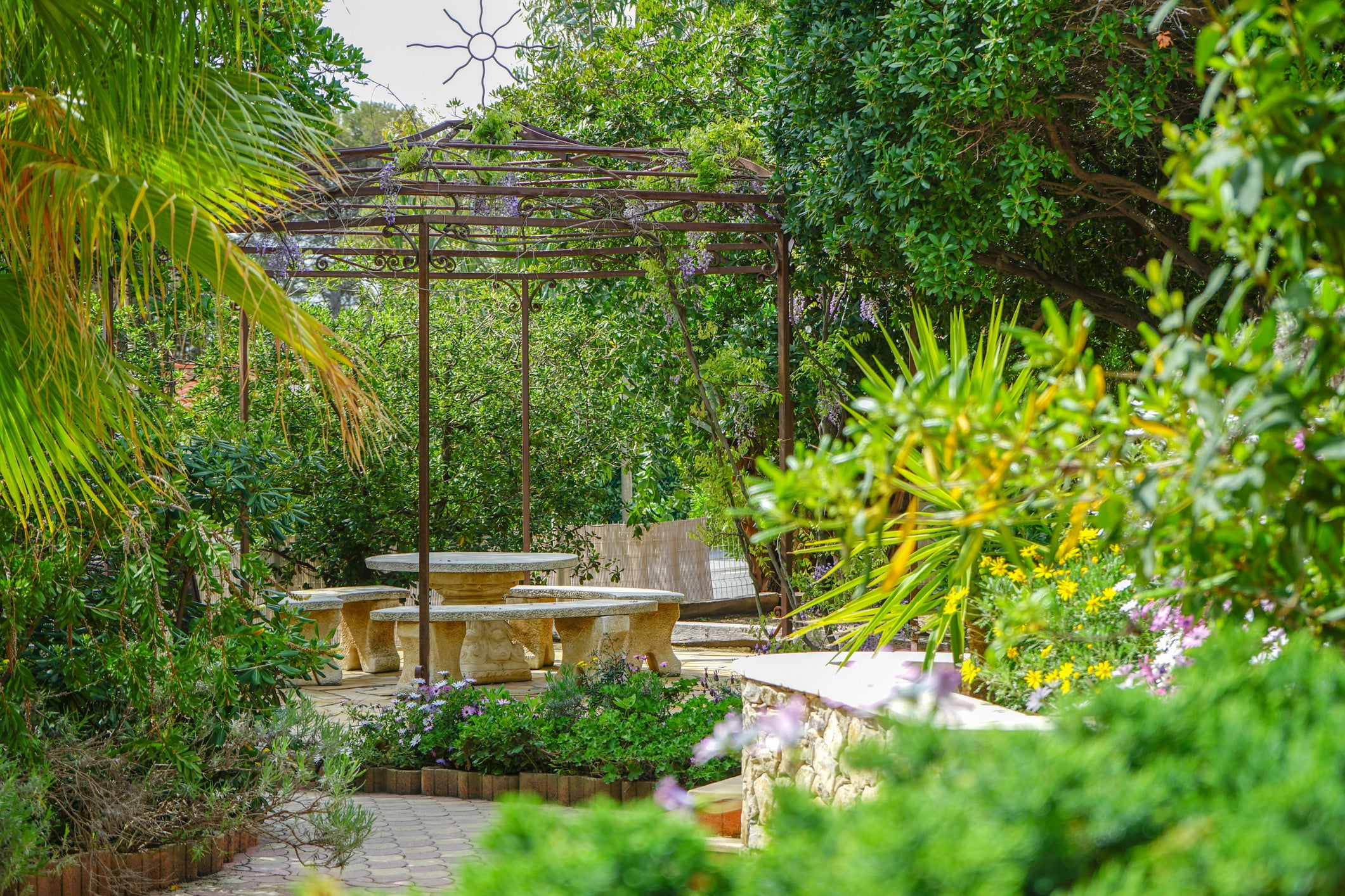 Make every area work hard with pergolas, fire pits and outdoor kitchens