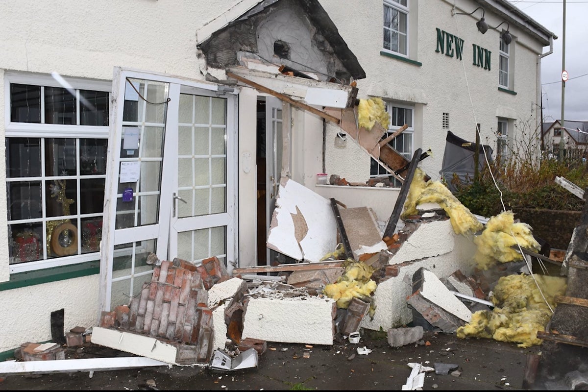 Man ploughs stolen bulldozer into village pub after taunts over marriage breakdown
