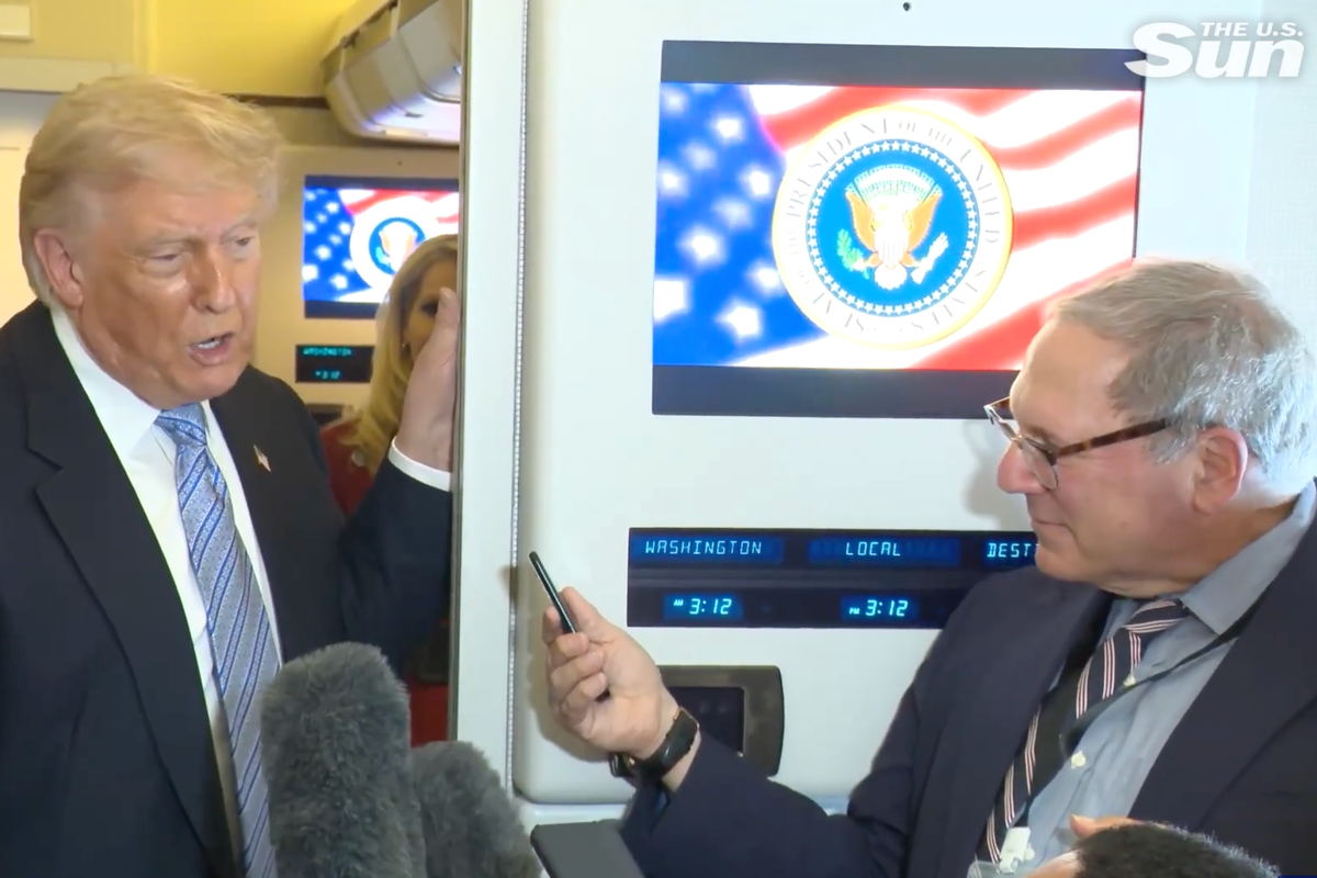 Trump gets right in reporter’s face on flight from China and calls him ‘treasonous’ over Iran question