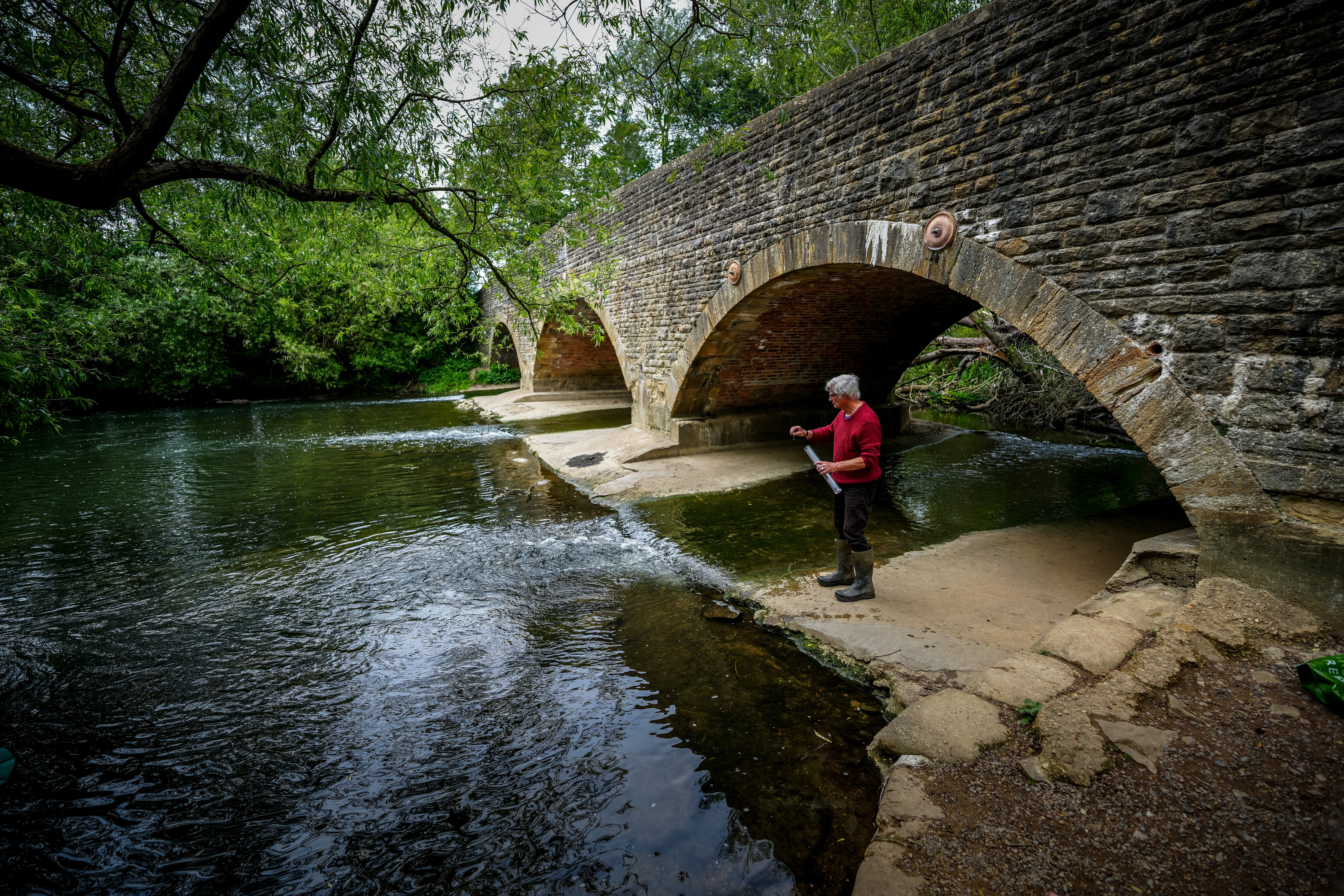 Water Quality Rated 'Poor' at Designated Bathing Area in Oxfordshire. Local volunteer Bob Swan tests the water at Wolvercote Mill Stream in 2025