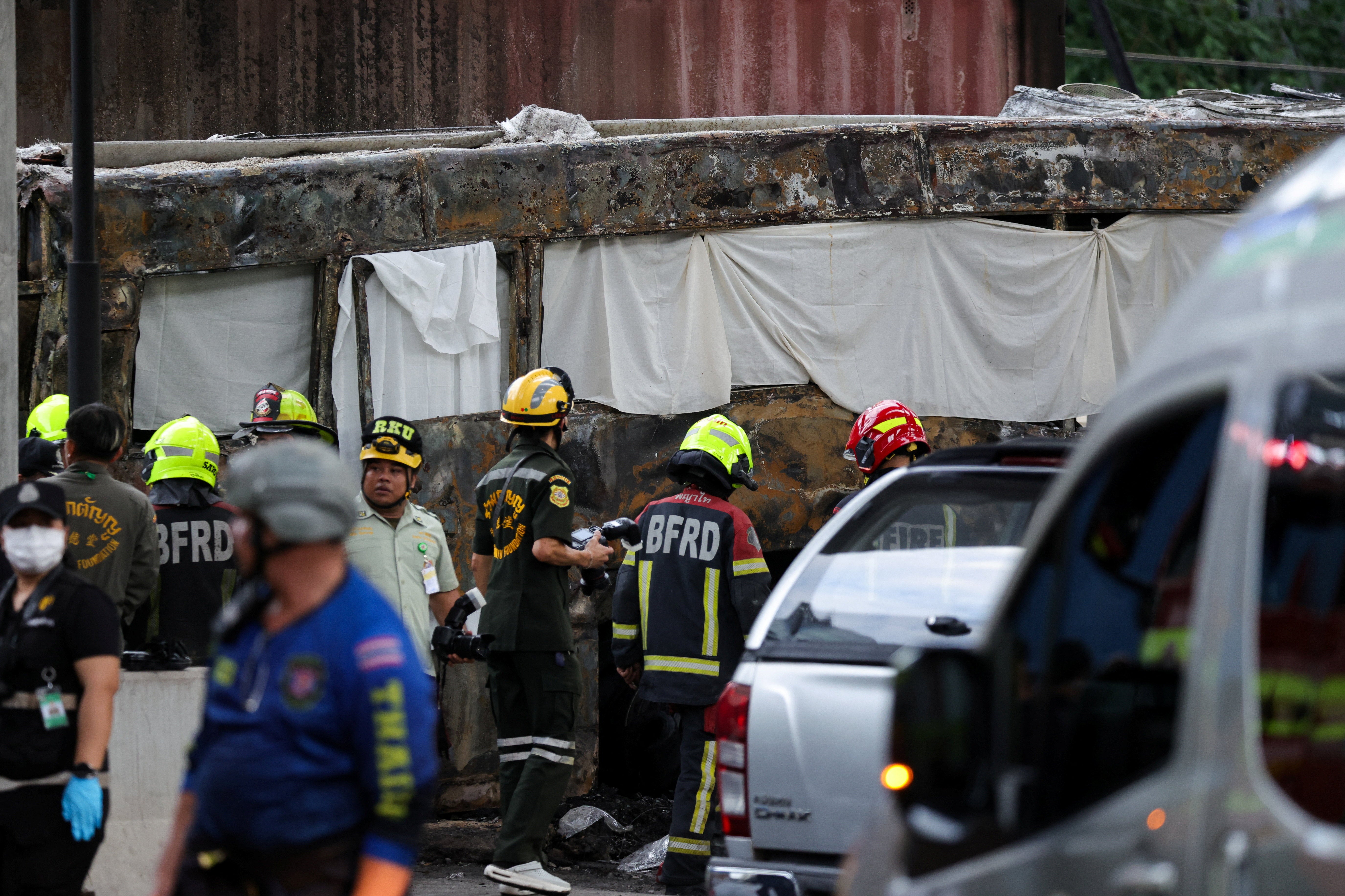 Emergency services at the scene on Asok-Din Daeng Road (Reuters)