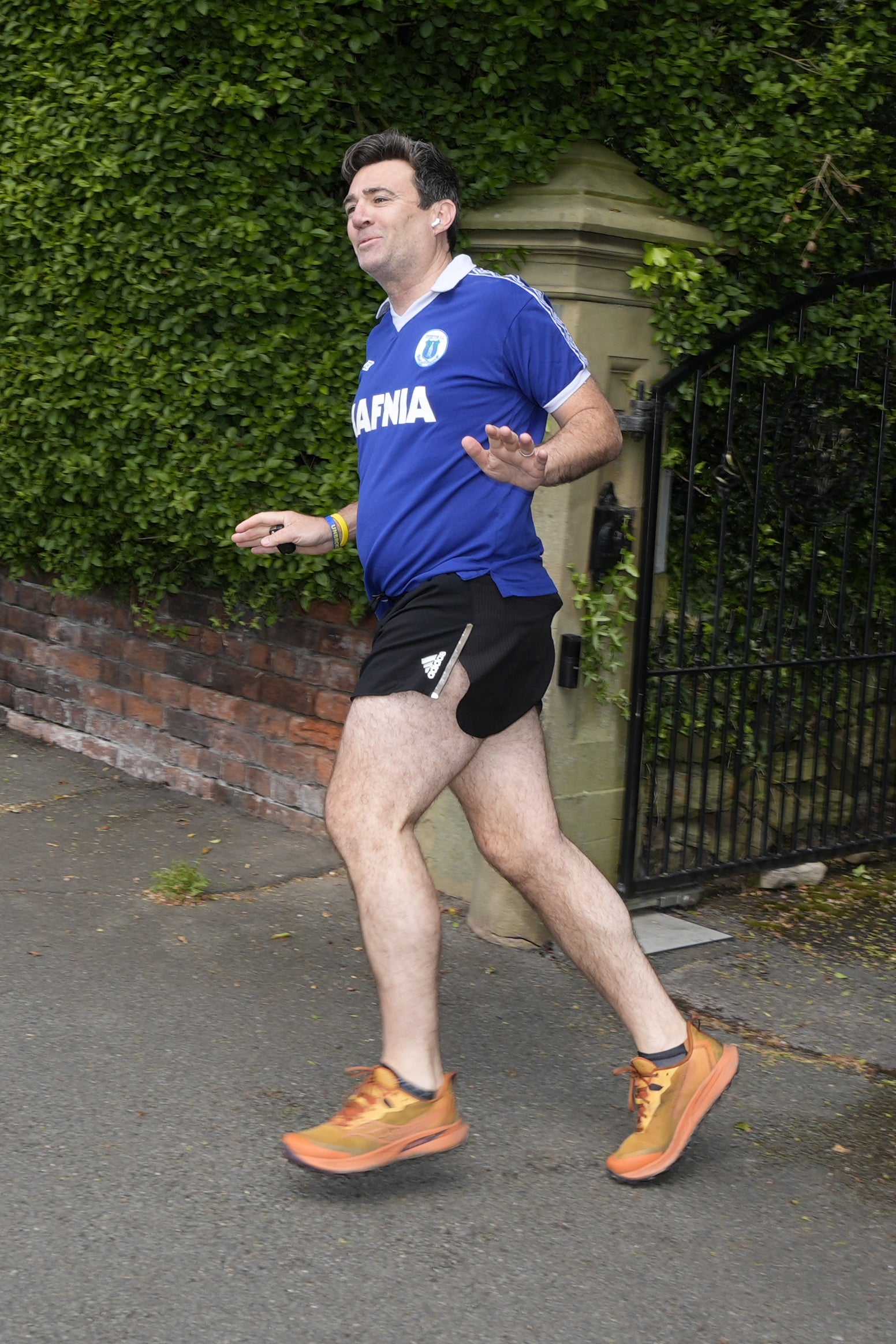 Mayor of Greater Manchester Andy Burnham running outside his house in Warrington, Cheshire on Friday (Peter Byrne/PA)