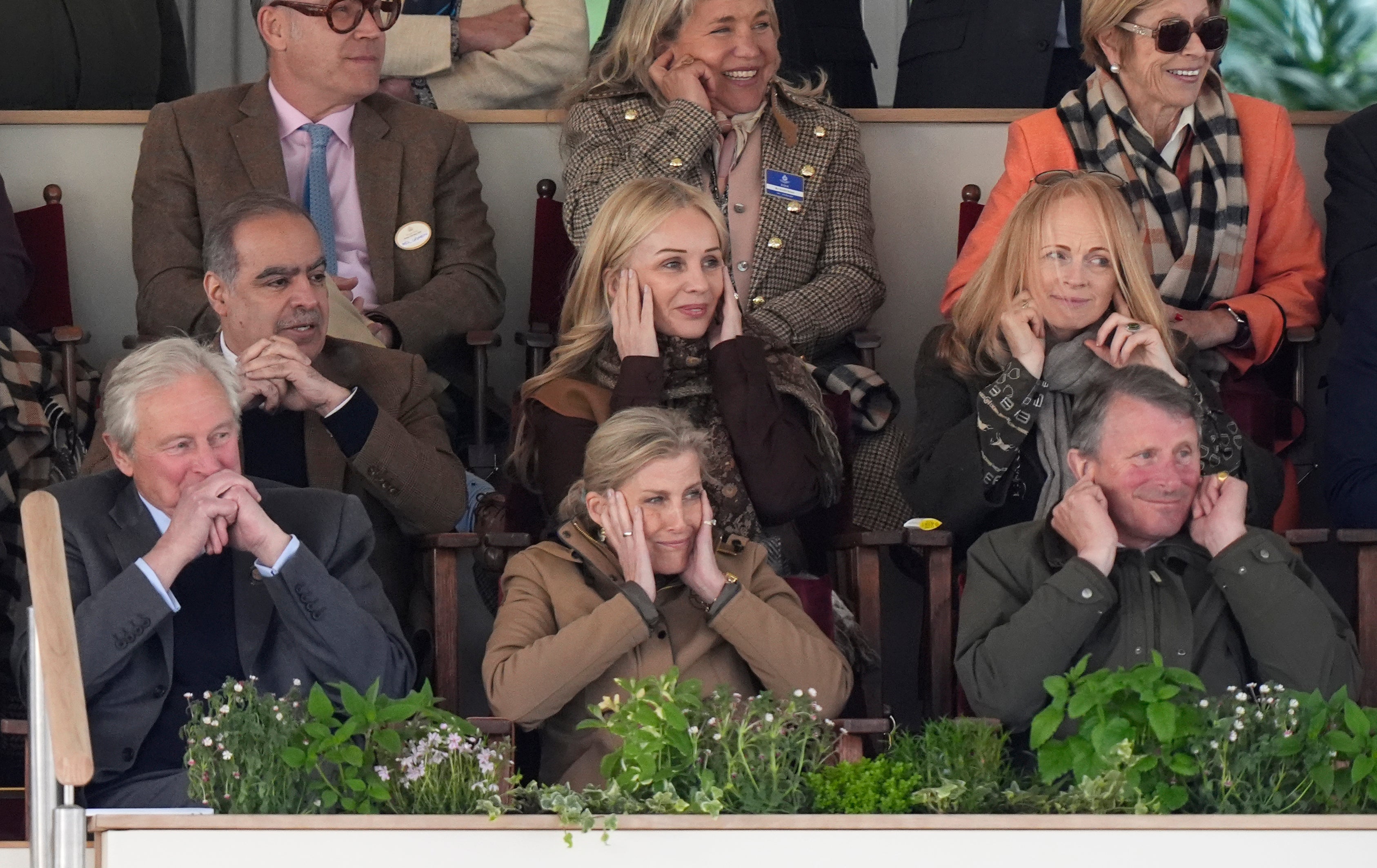 The Duchess of Edinburgh (centre) reacts to members of the King's Corps and Royal Horse Artillery firing their weapons during the Royal Windsor Horse Show