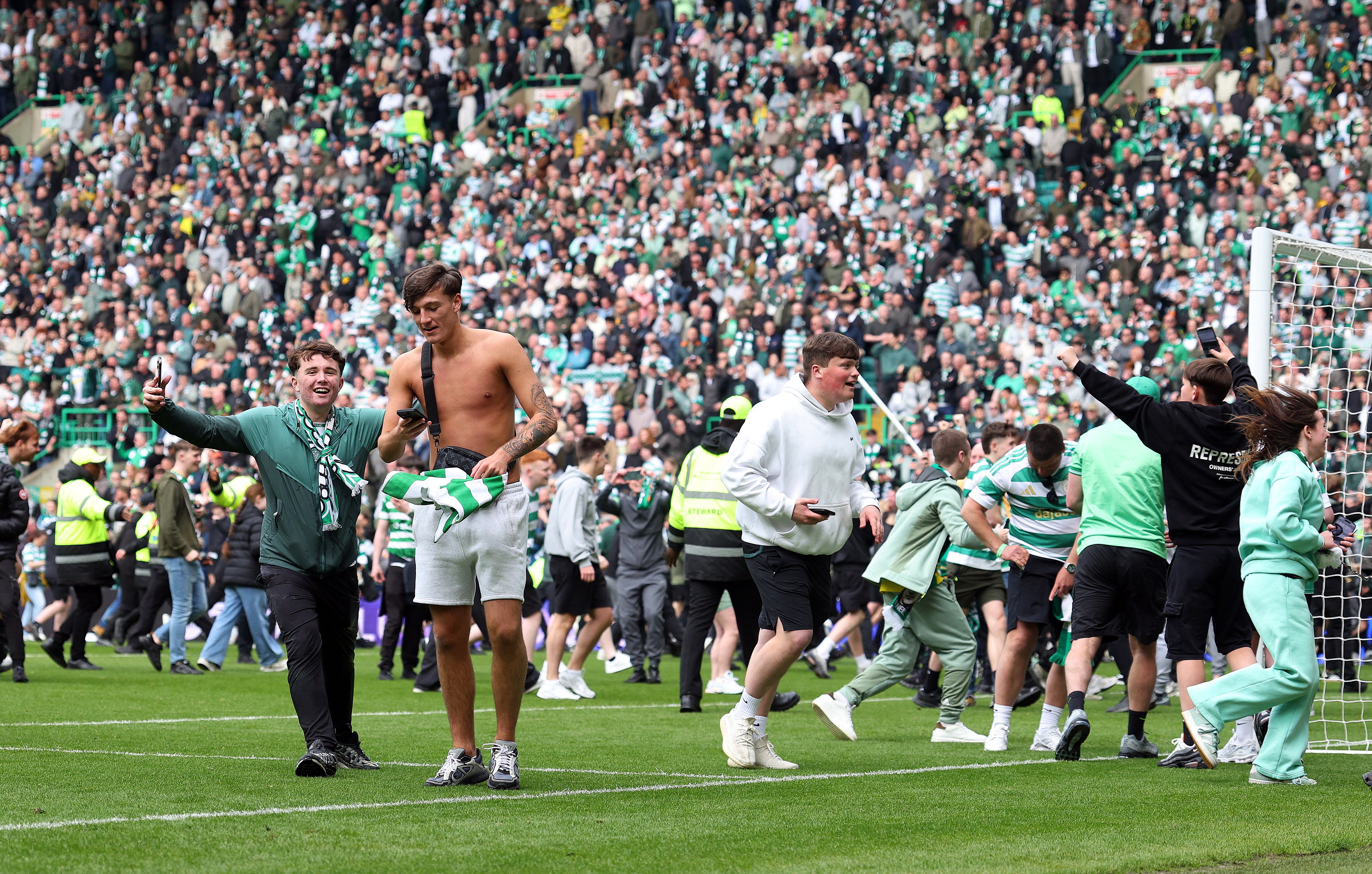 Celtic fans invade the pitch after Callum Osmand scores their third goal
