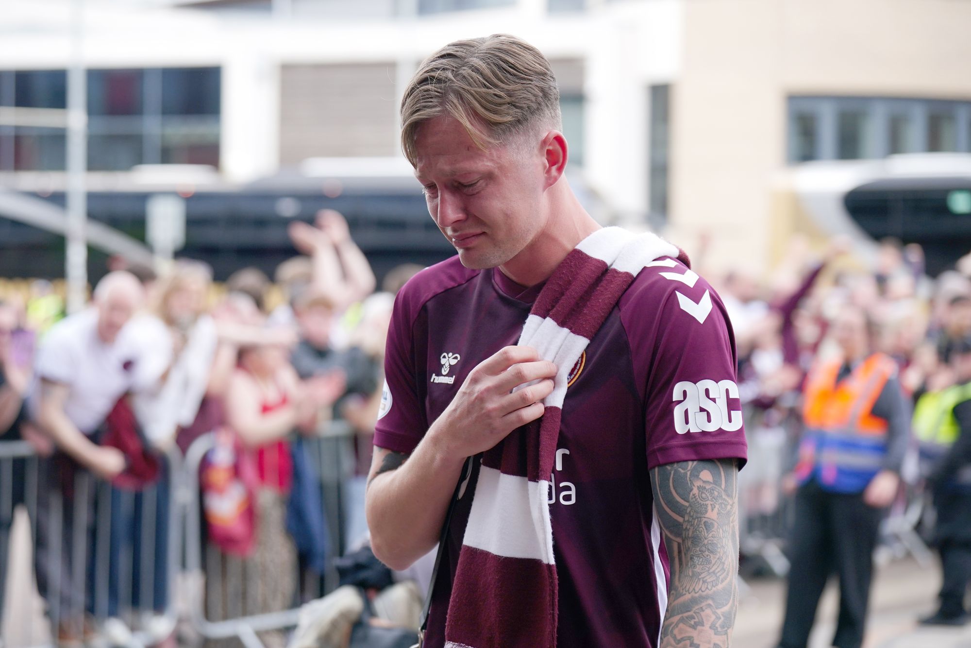 Heart of Midlothian player Frankie Kent becomes emotional as he walks past fans